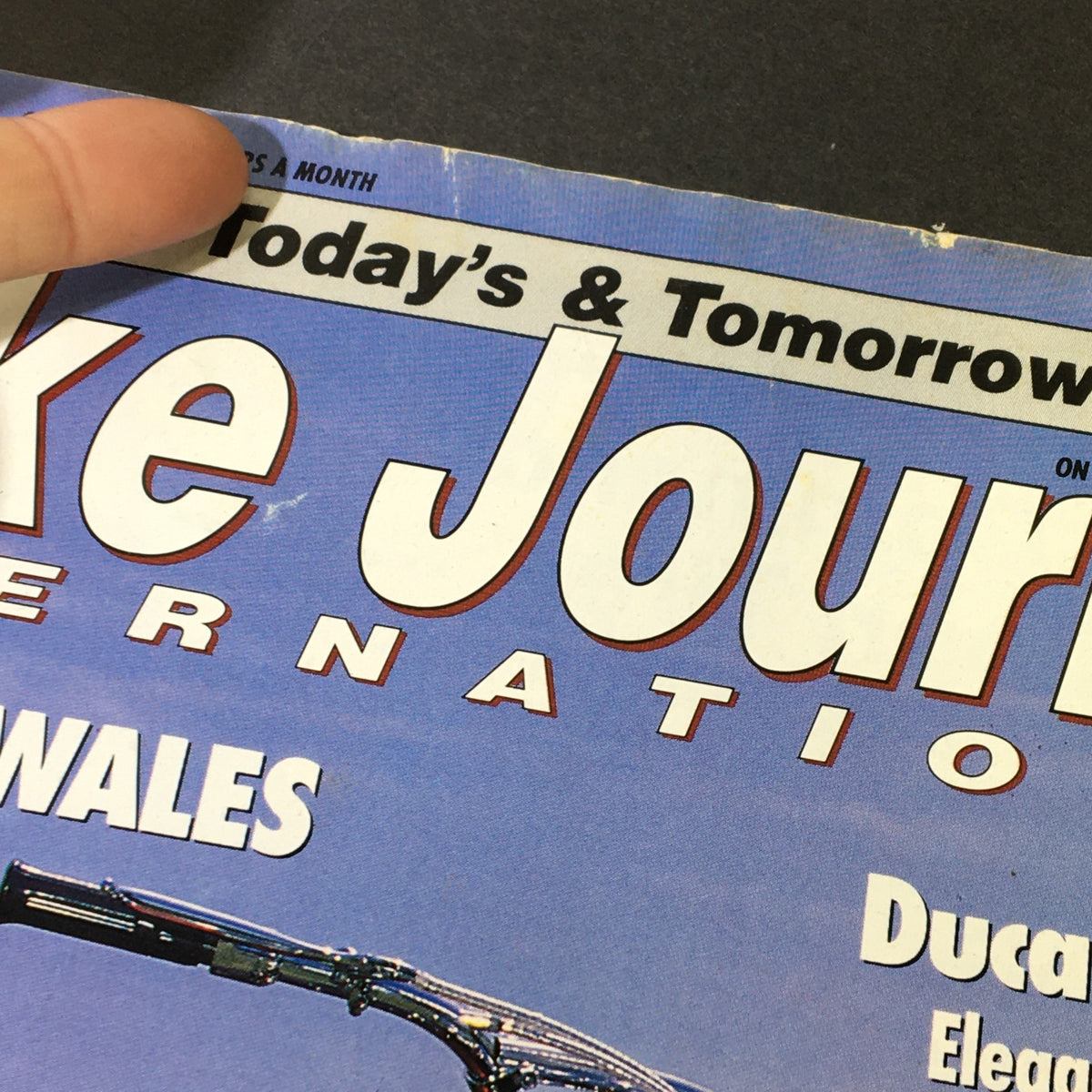 Top section of Bike Journal International Magazine September 2015 showcasing the title and focus on touring Wales with Ducati Desmo.
