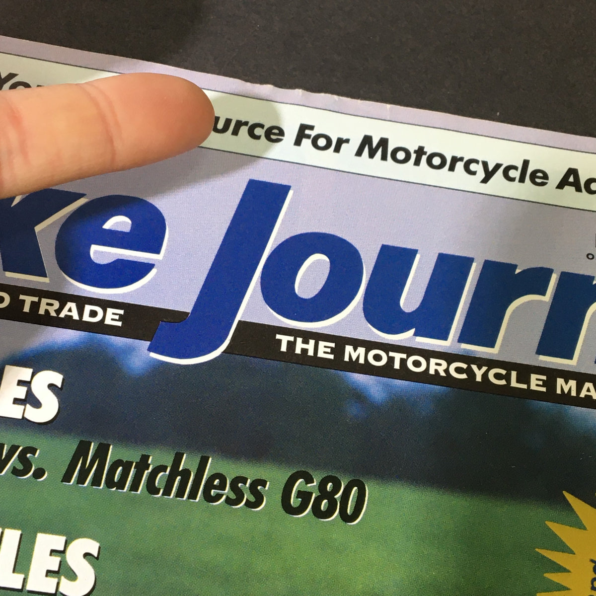 Close-up of the header of Bike Journal Magazine November 2017, emphasizing its tagline as a leading source for motorcycle ads and the featured review of Honda GB500 vs Matchless G80.