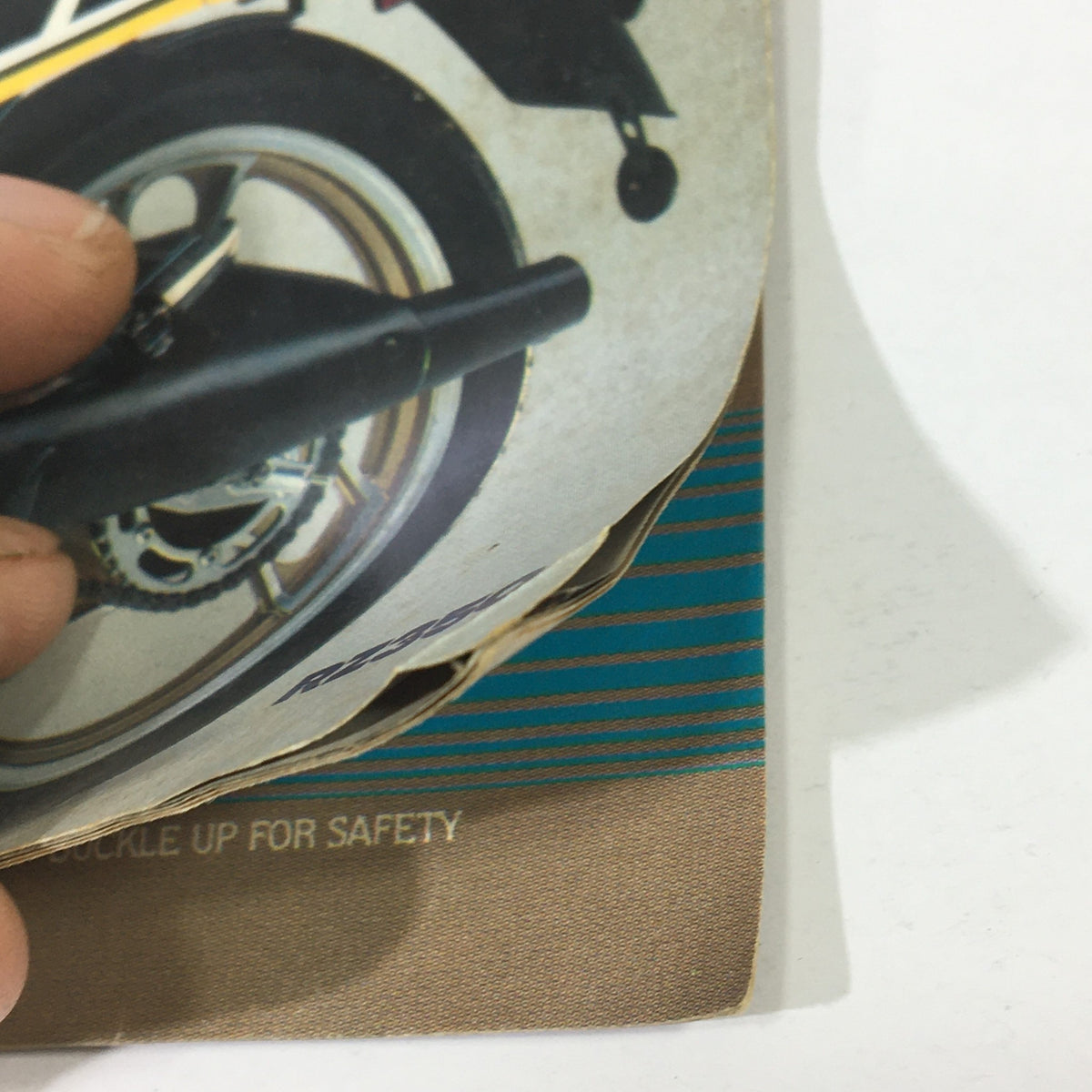 Close-up image of a motorcycle wheel section featured in VTG Cycle World Magazine December 1983.
