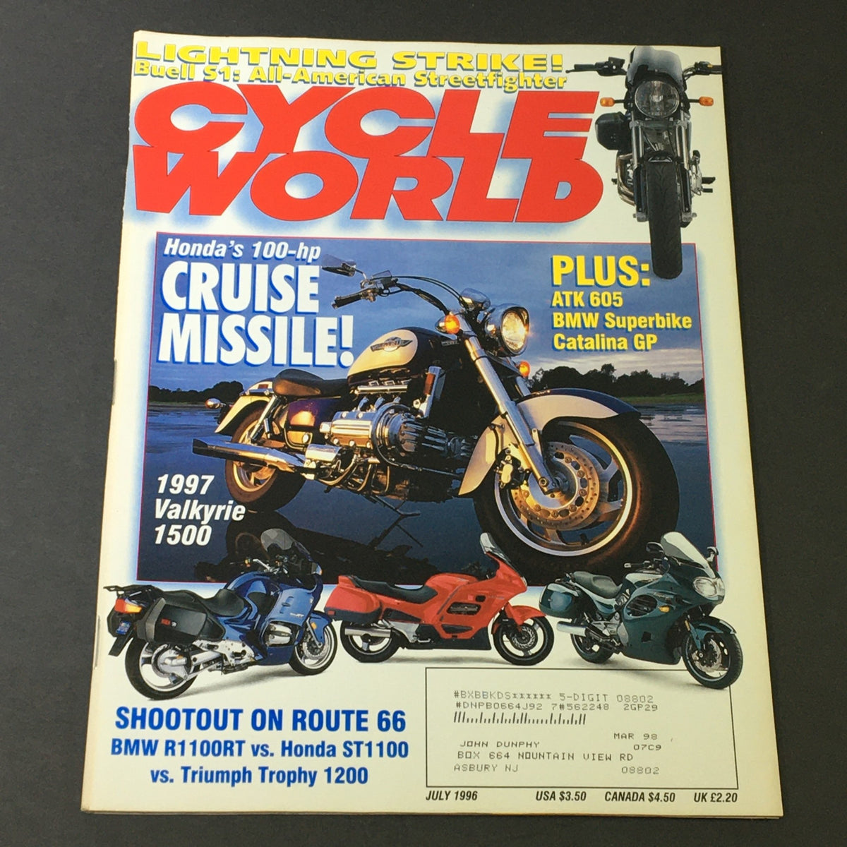 Cover of Cycle World Magazine July 1996 featuring a face-off between BMW R1100RT, Honda ST1100, and Triumph Trophy 1200, showcasing motorcycle comparisons and features.