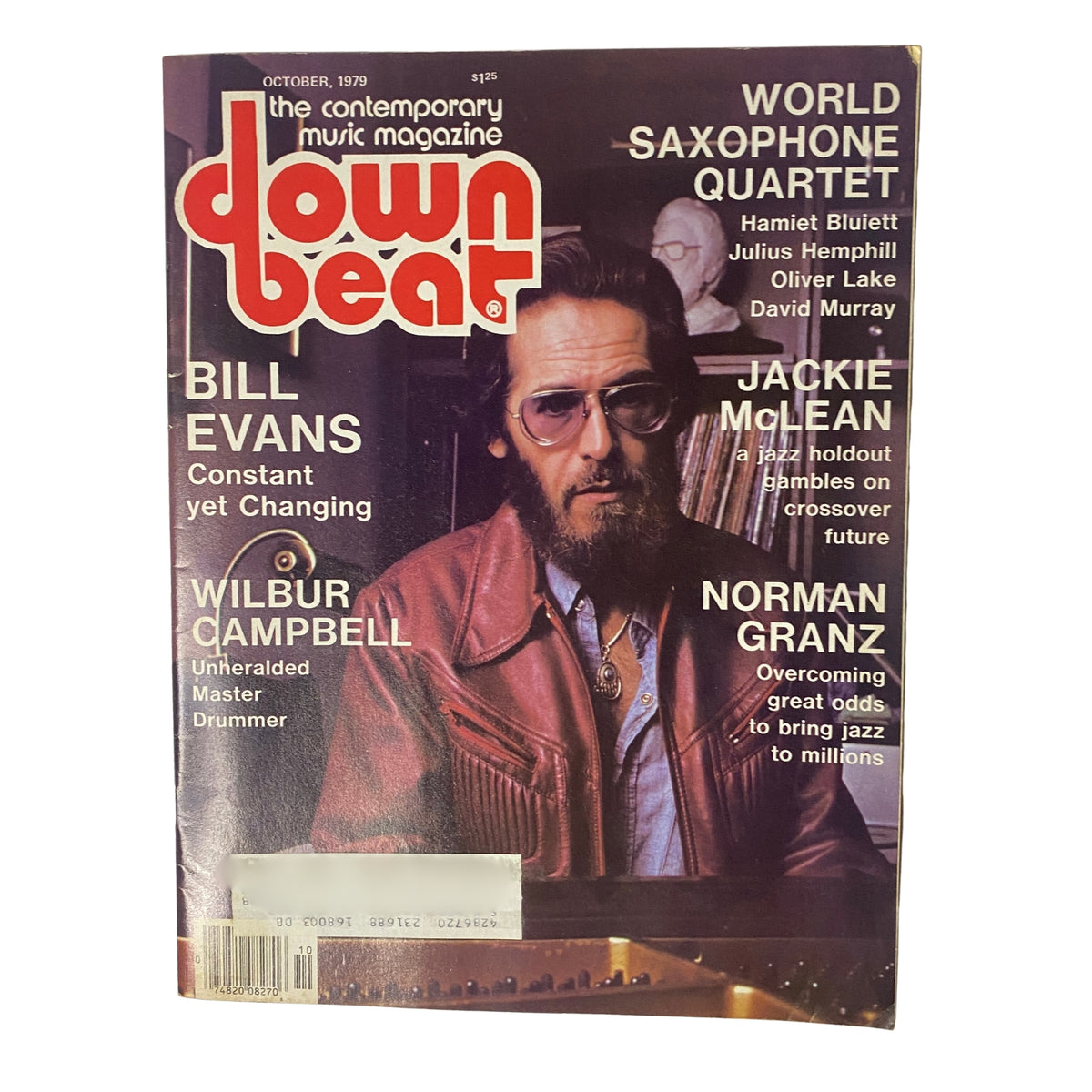 Cover of Down Beat Magazine, October 1979 featuring Bill Evans, Wilbur Campbell, Jackie McLean, and Norman Granz, highlighting jazz artists and culture.