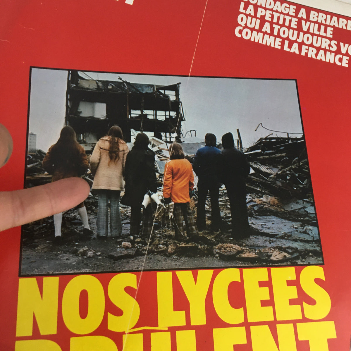Cover of Paris Match Magazine February 1973 featuring the headline 'Nos Lycees Brulent' showing a group of individuals observing a destroyed building.