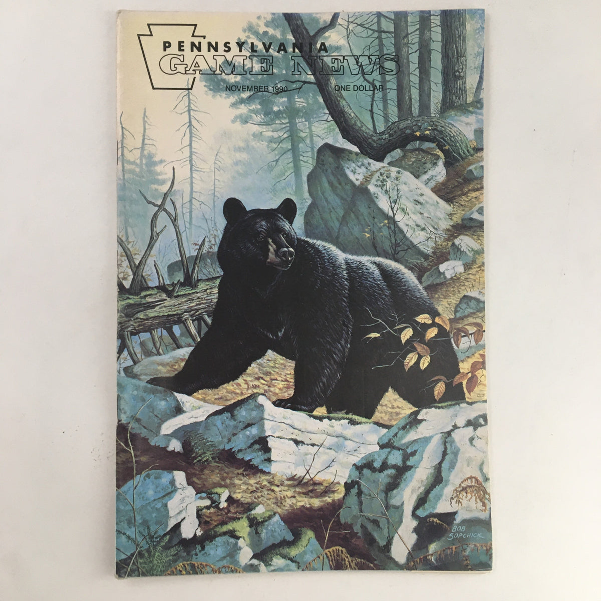 Cover of Pennsylvania Game News November 1990 featuring Mercer County's First Bear, artist Bob Sopchick's painting depicting a black bear in a natural landscape surrounded by trees and rocks.
