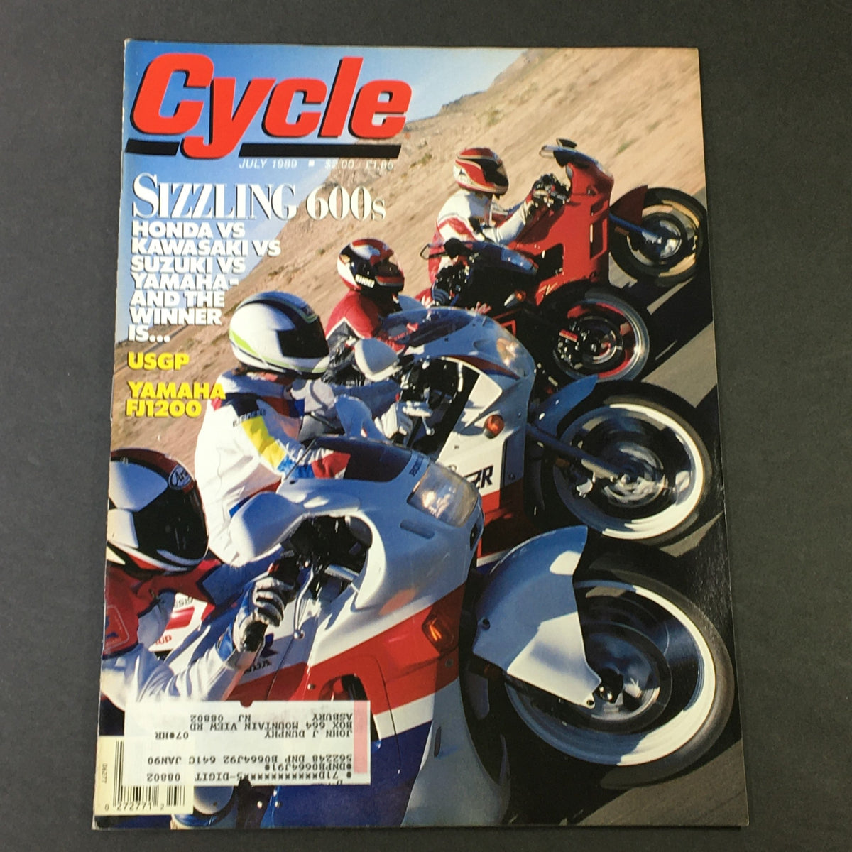 Cycle Magazine July 1989 cover featuring a dynamic motorcycle race with Honda, Kawasaki, Suzuki, and Yamaha FJ1200 models, showcasing the competitive spirit of motorcycle enthusiasts in the late 80s.