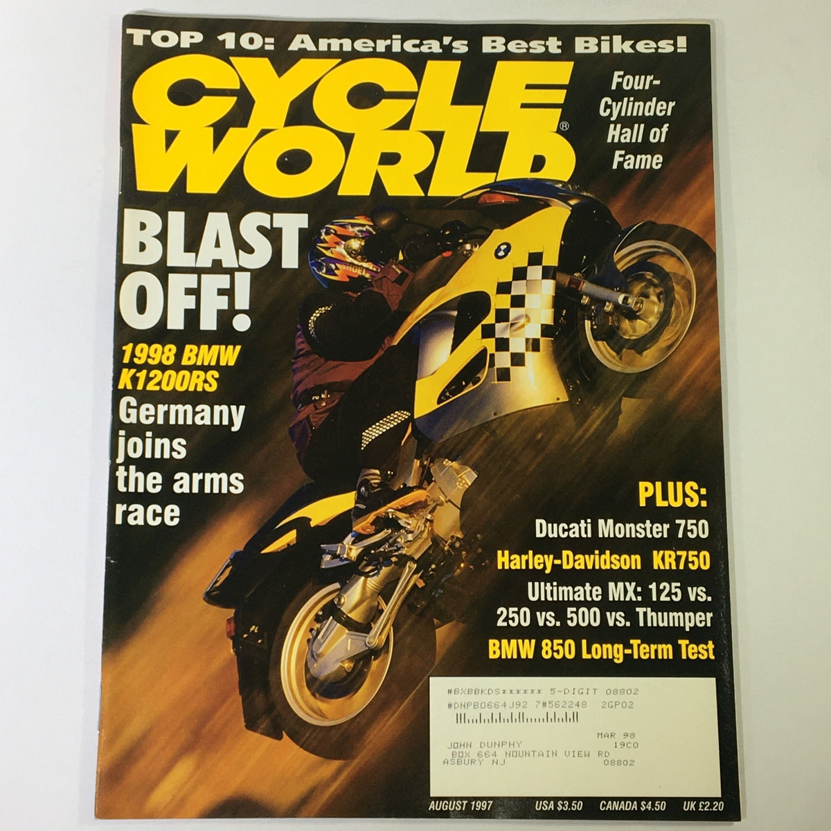 Cycle World Magazine August 1997 featuring the BMW K1200RS and Ducati Monster 750 on the cover. Captivating image of a rider on the yellow BMW motorcycle with text highlighting articles on top motorcycles of the era.