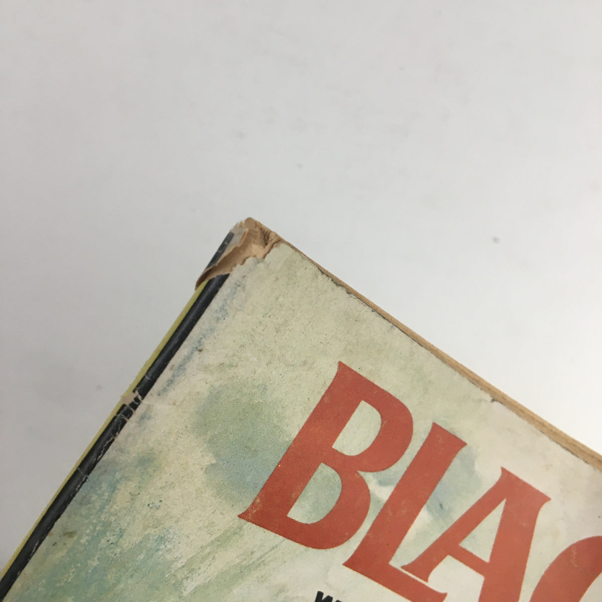 Close-up of the top corner of Black Belt Magazine September 1966, showing wear and tear indicative of its vintage condition.