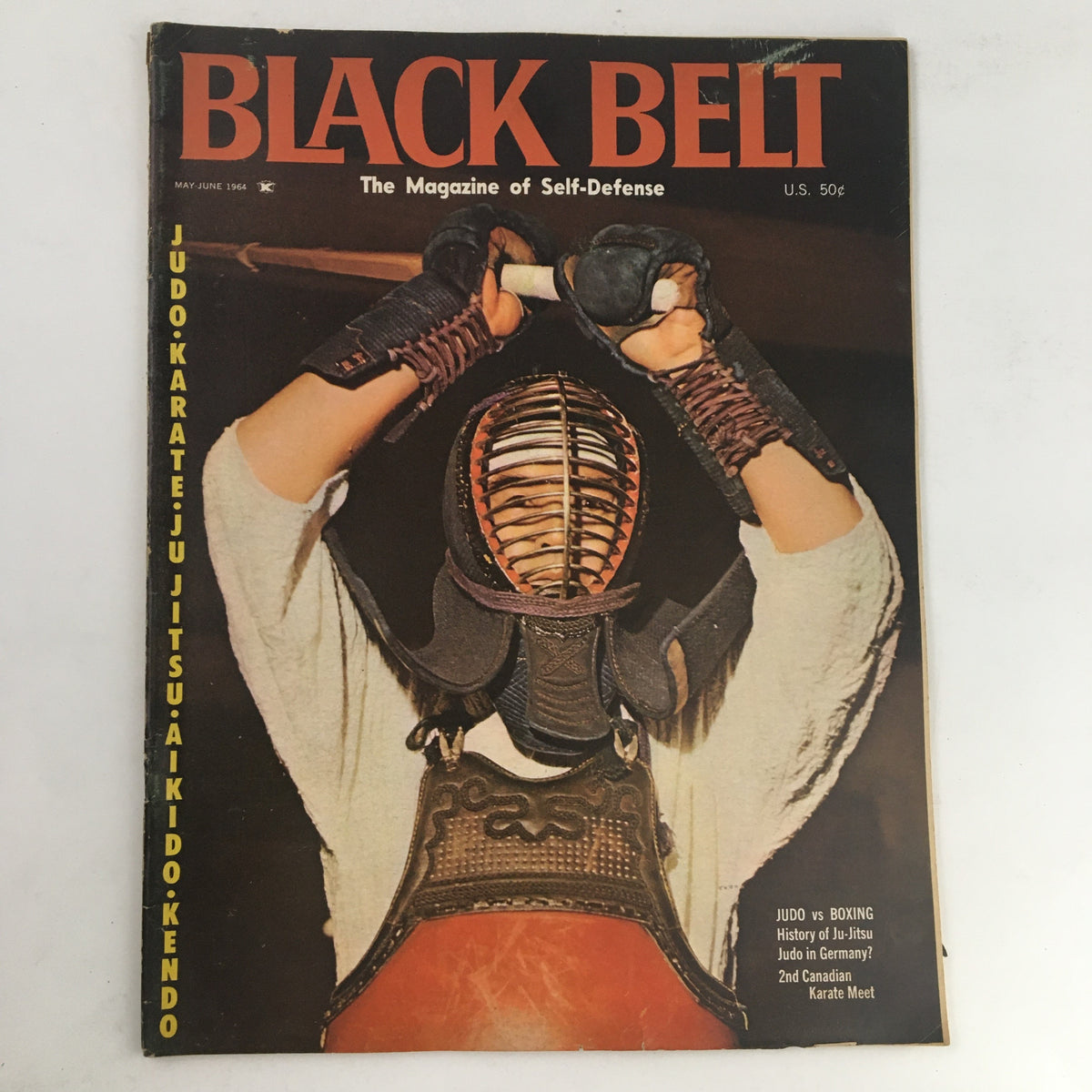 Cover of Black Belt Magazine May 1964 Vol. 2 No. 3 featuring a martial artist in traditional gear, focusing on the Judo vs Boxing article highlighted in the issue.