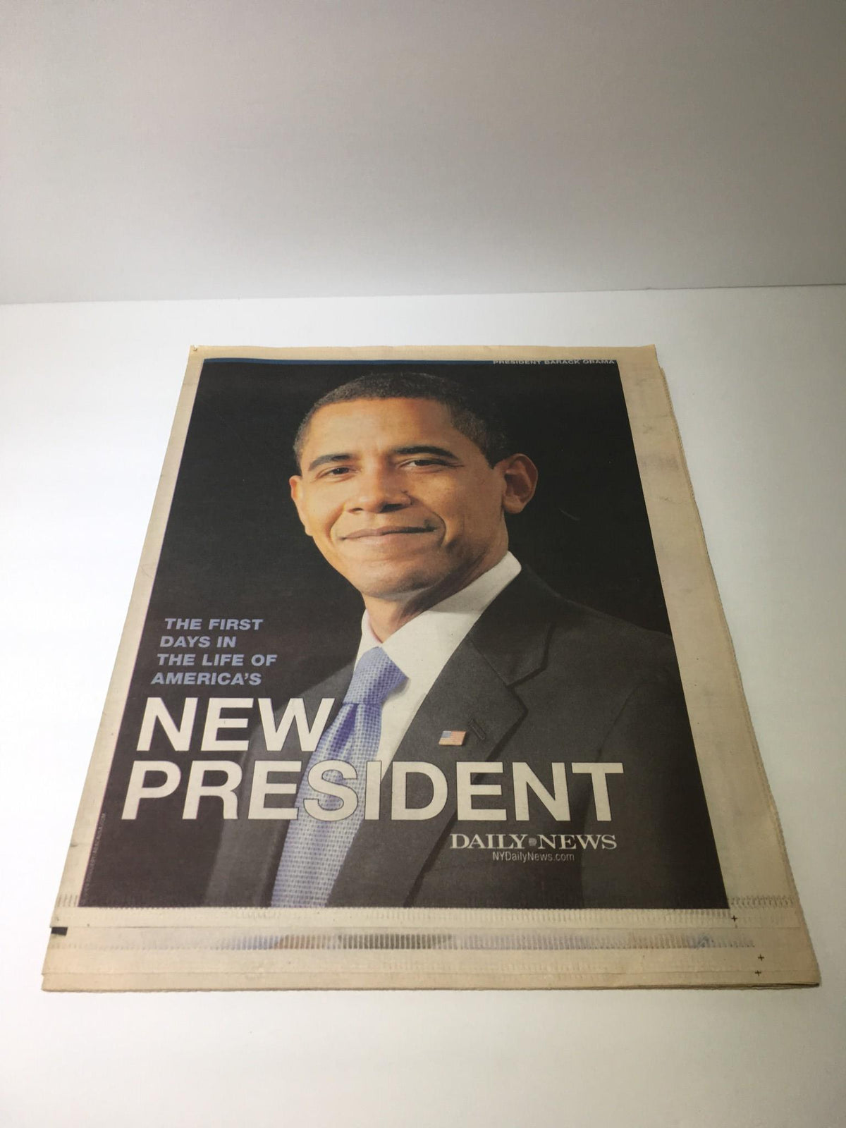 NY Daily News January 25, 2009, featuring a portrait of America's New President, Barack Obama, symbolizing the first days in his presidential term.