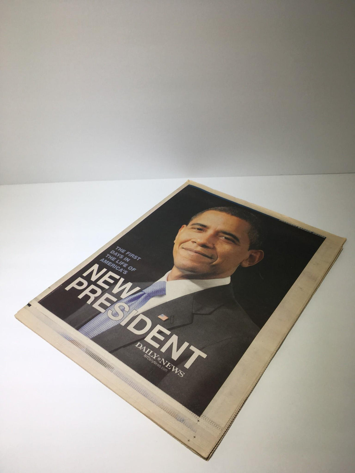 Cover of NY Daily News from January 25, 2009, featuring a smiling Barack Obama with the bold title, The First Days In The Life Of America's New President.