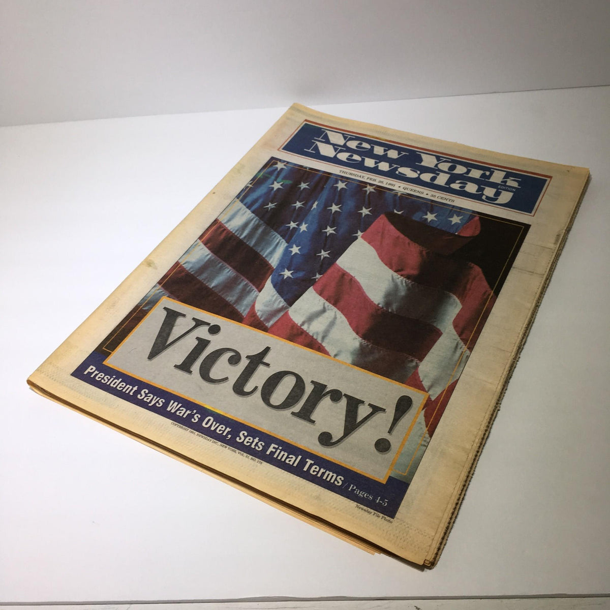 Newsday newspaper from February 28, 1991, featuring the title 'Victory! President Says War's Over, Sets Final Terms', showcasing an American flag on the cover.