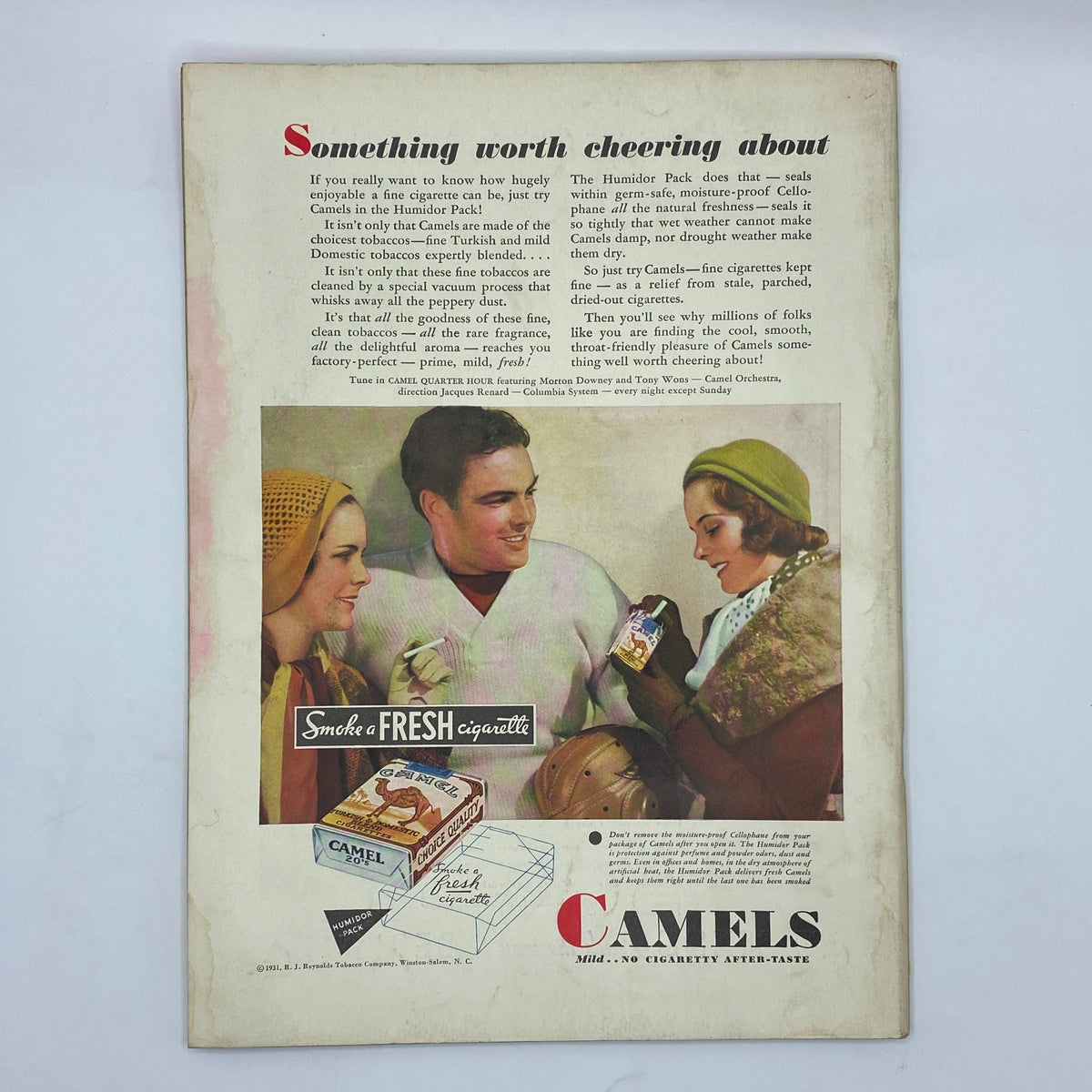 Vintage advertisement on the back cover of The New Yorker Complete Magazine from November 28, 1931, featuring a colorful image promoting Camel cigarettes, highlighting their smoothness and freshness.