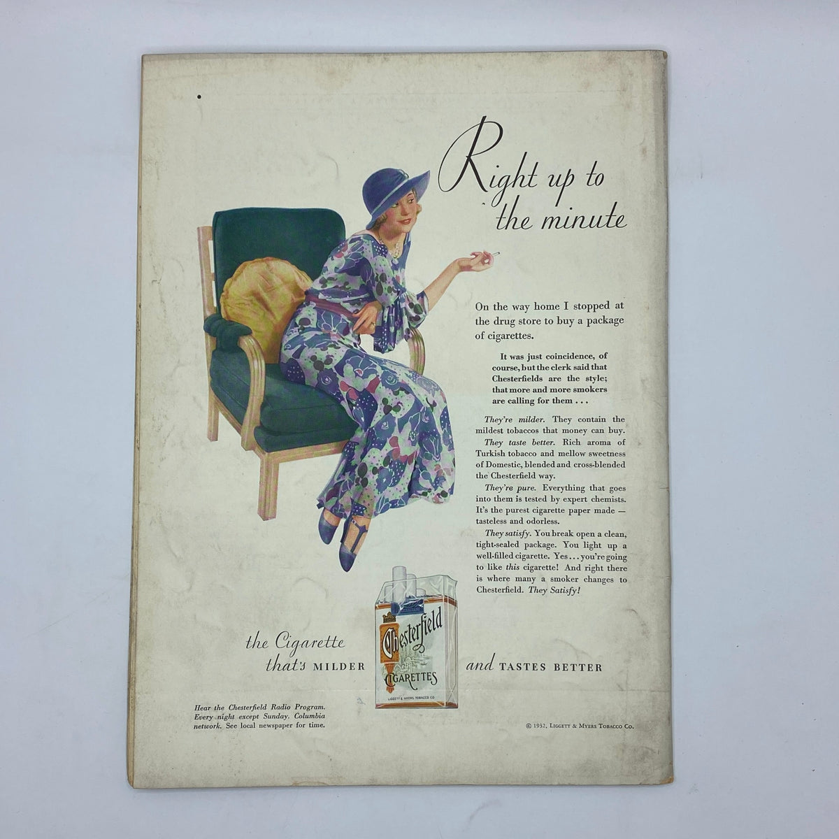 a woman sitting in a chair with a cat on her lap