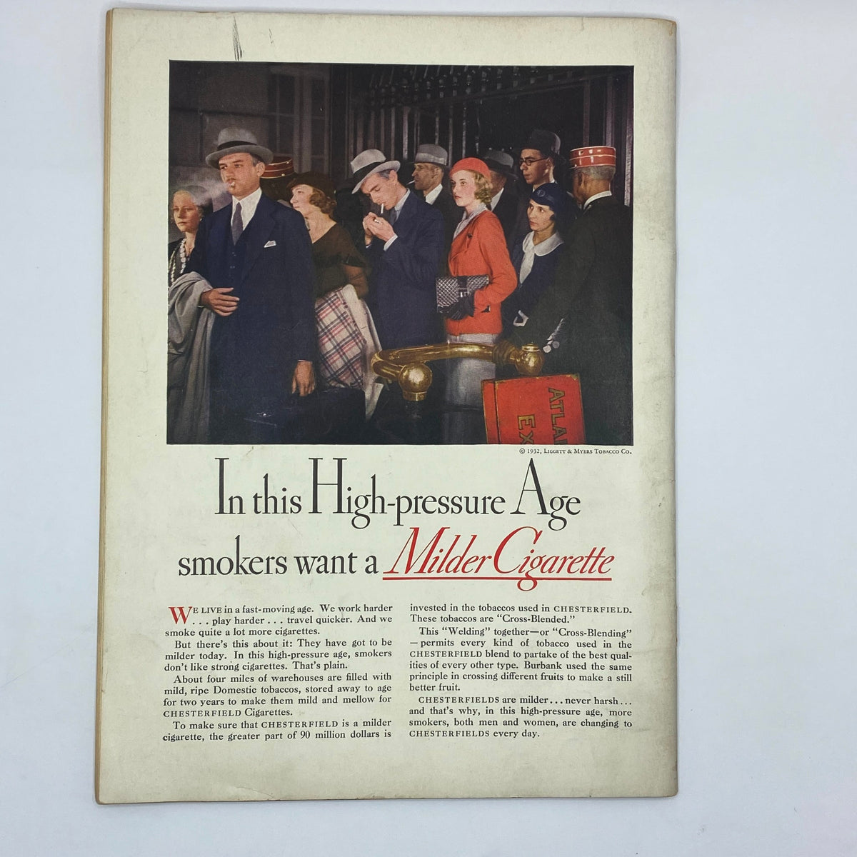 Vintage advertisement from The New Yorker November 12, 1932, featuring a crowd of smokers discussing Chesterfield cigarettes, emphasizing their mildness in a high-pressure age.