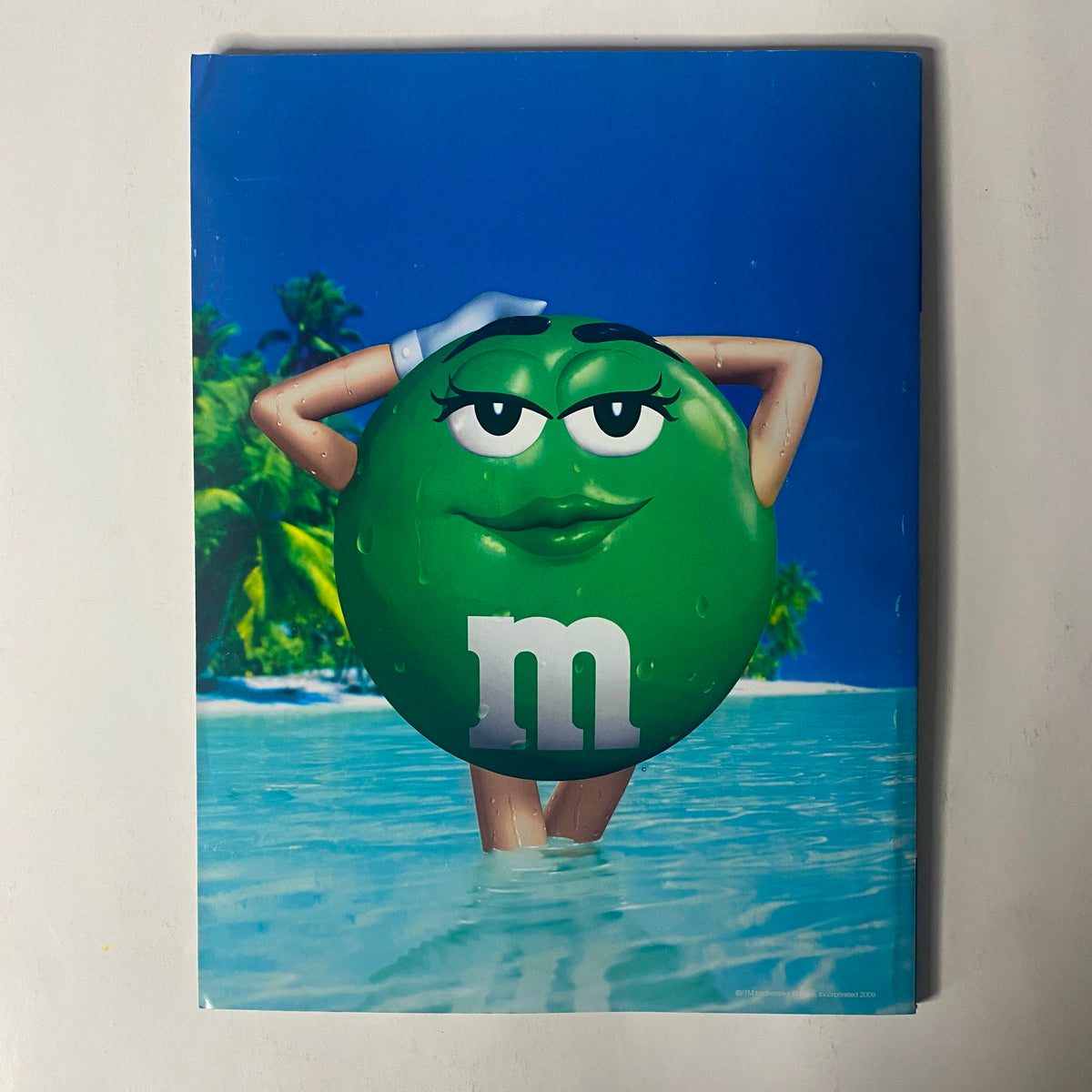 Back cover of Sports Illustrated Magazine February 13, 2009 displaying an advertisement for M&M's featuring a playful character in a swimming pool setting, promoting the iconic candy in a tropical theme.