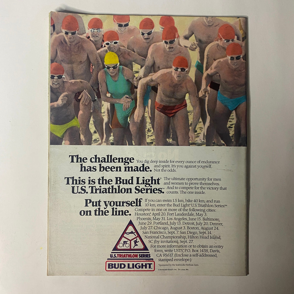Back cover of Tri-Athlete Magazine June 1986 featuring an advertisement for the Bud Light U.S. Triathlon Series, showcasing athletes in swim caps during a competitive event.