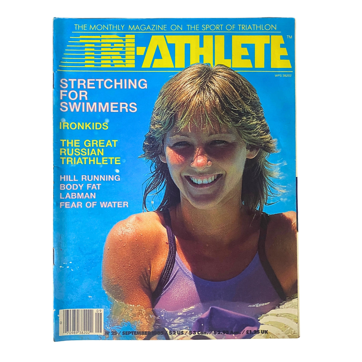 Cover of Tri-Athlete Magazine September 1985, Issue No. 25 featuring a smiling female athlete. The magazine highlights articles such as 'Stretching for Swimmers,' 'IronKids,' and 'The Great Russian Triathlete.'