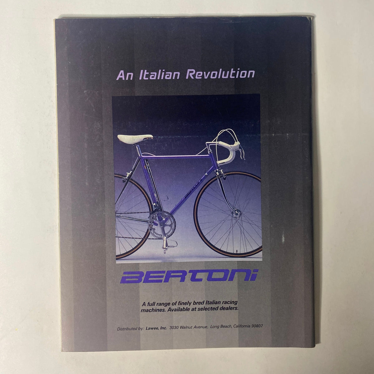 Vintage Bertoni bicycle advertisement featuring a sleek design, captioned 'An Italian Revolution,' part of 'Triathlon Magazine March 1986 Vol 4 No. 2 Joanne Ernst & Scott Tinley' issue.