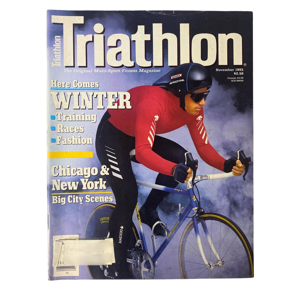Cover of Triathlon Magazine November 1985 Vol 3 No. 8 featuring Southern California's John Skorstad in cold-weather bike gear, highlighting winter training, races, and fashion.