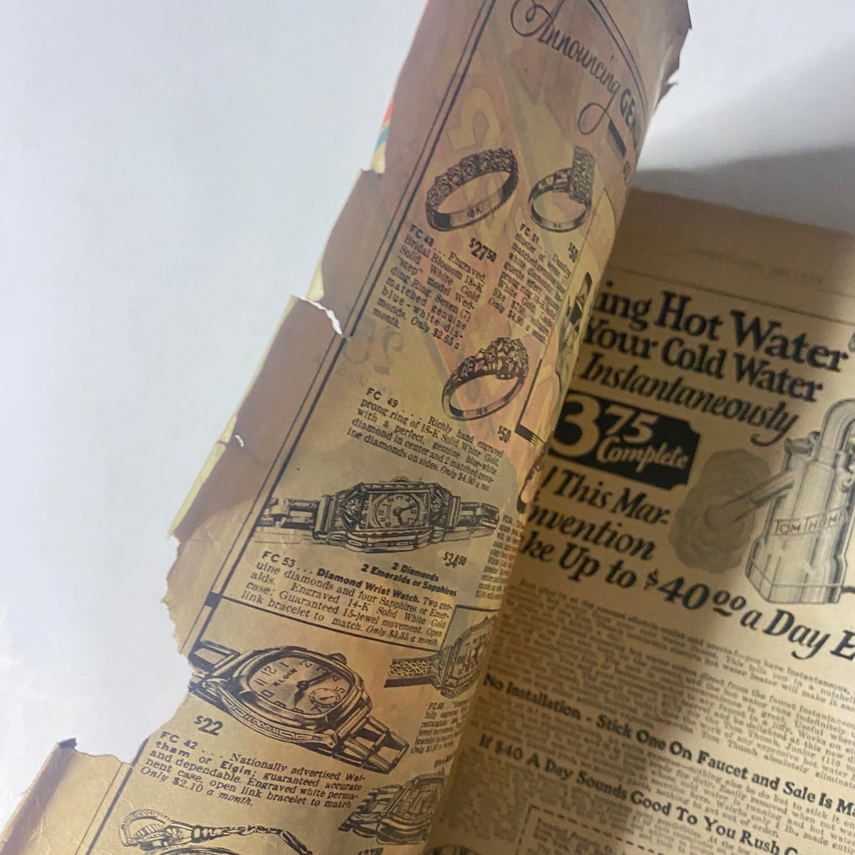 Close-up of an interior advertisement page from The Popular Magazine September 1931, detailing vintage jewelry and appliances, indicative of the era's advertising style.