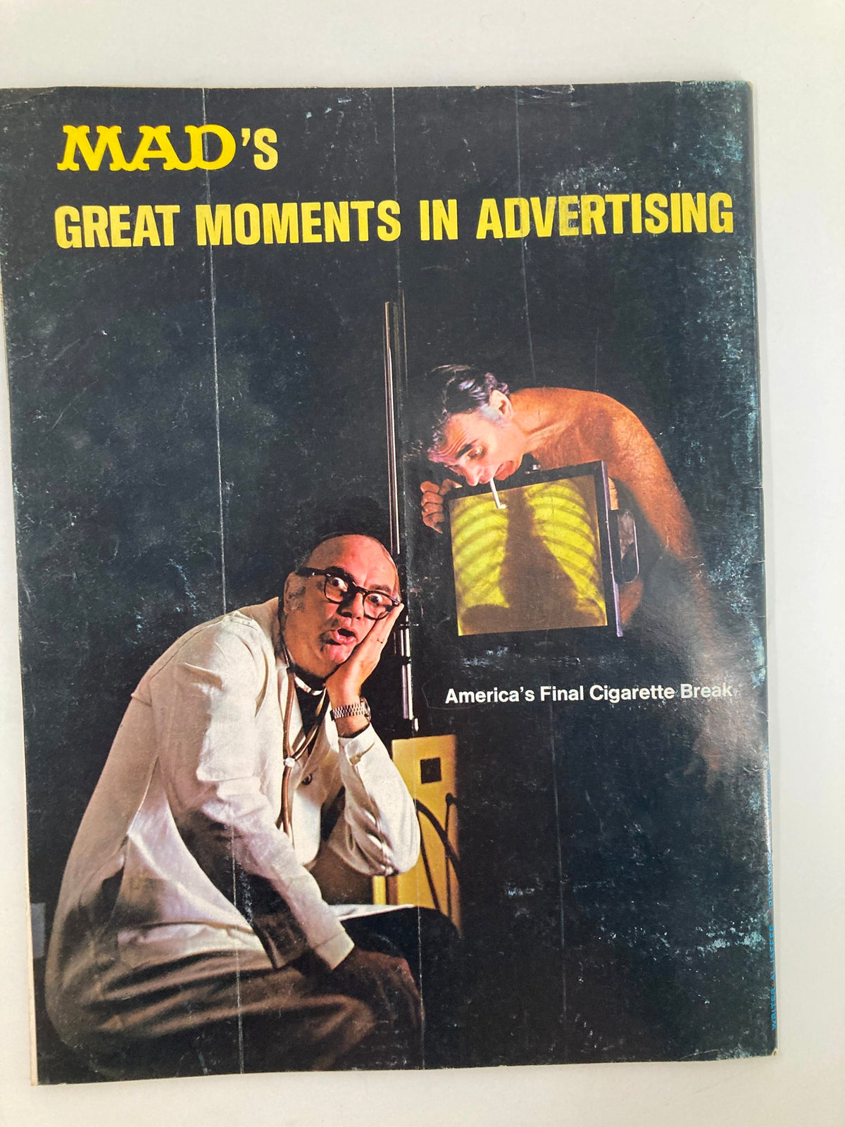 Back cover of a Mad magazine titled 'MAD's Great Moments in Advertising,' featuring a humorous depiction related to advertising.