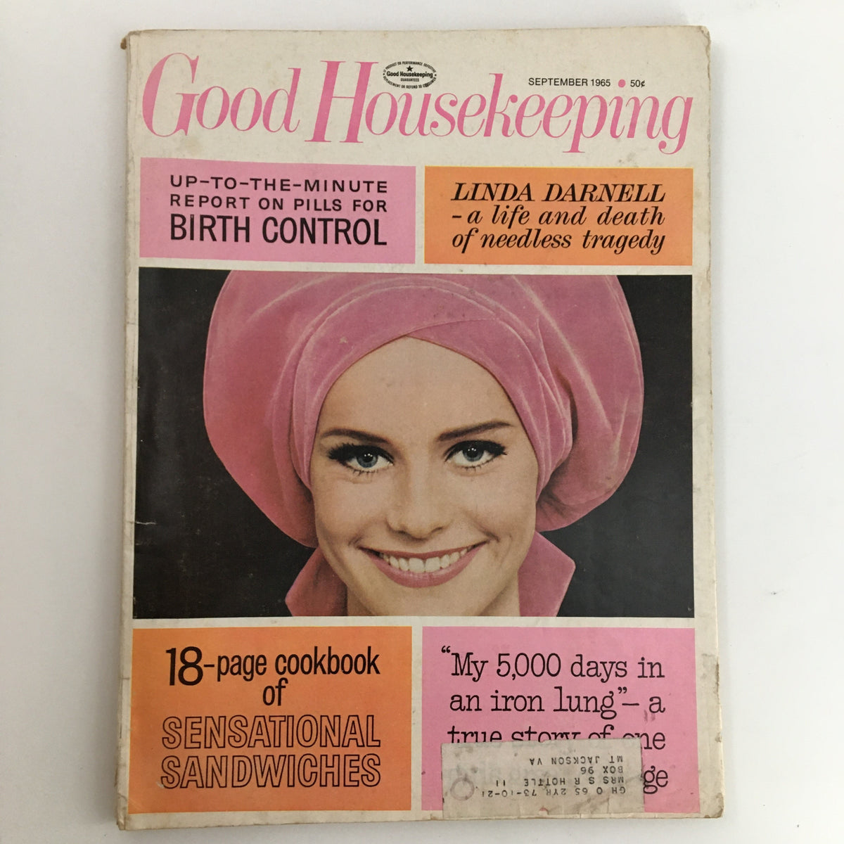 Vintage magazine cover of Good Housekeeping, September 1965 issue featuring the title 'Linda Darnell - a life and death of needless tragedy’. The cover shows a smiling woman in a pink headscarf, highlighting articles on birth control and sensational sandwiches.