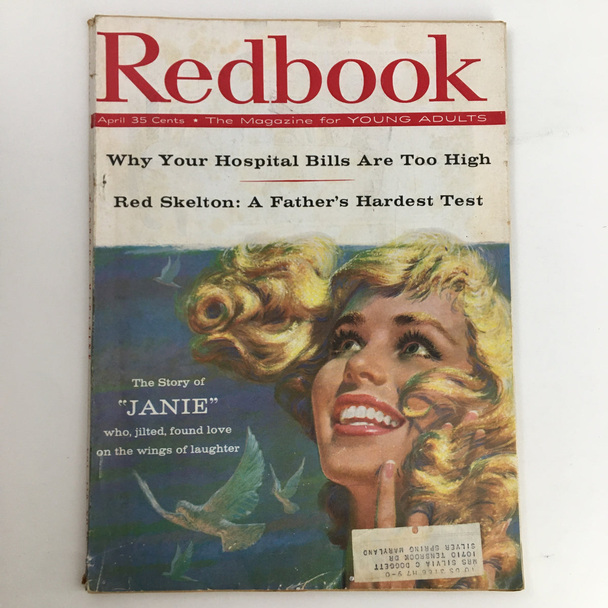 Cover of Redbook Magazine April 1958 featuring the story 'The Story of Janie' who found love, showcasing a smiling woman with blonde, curly hair and birds in the background.