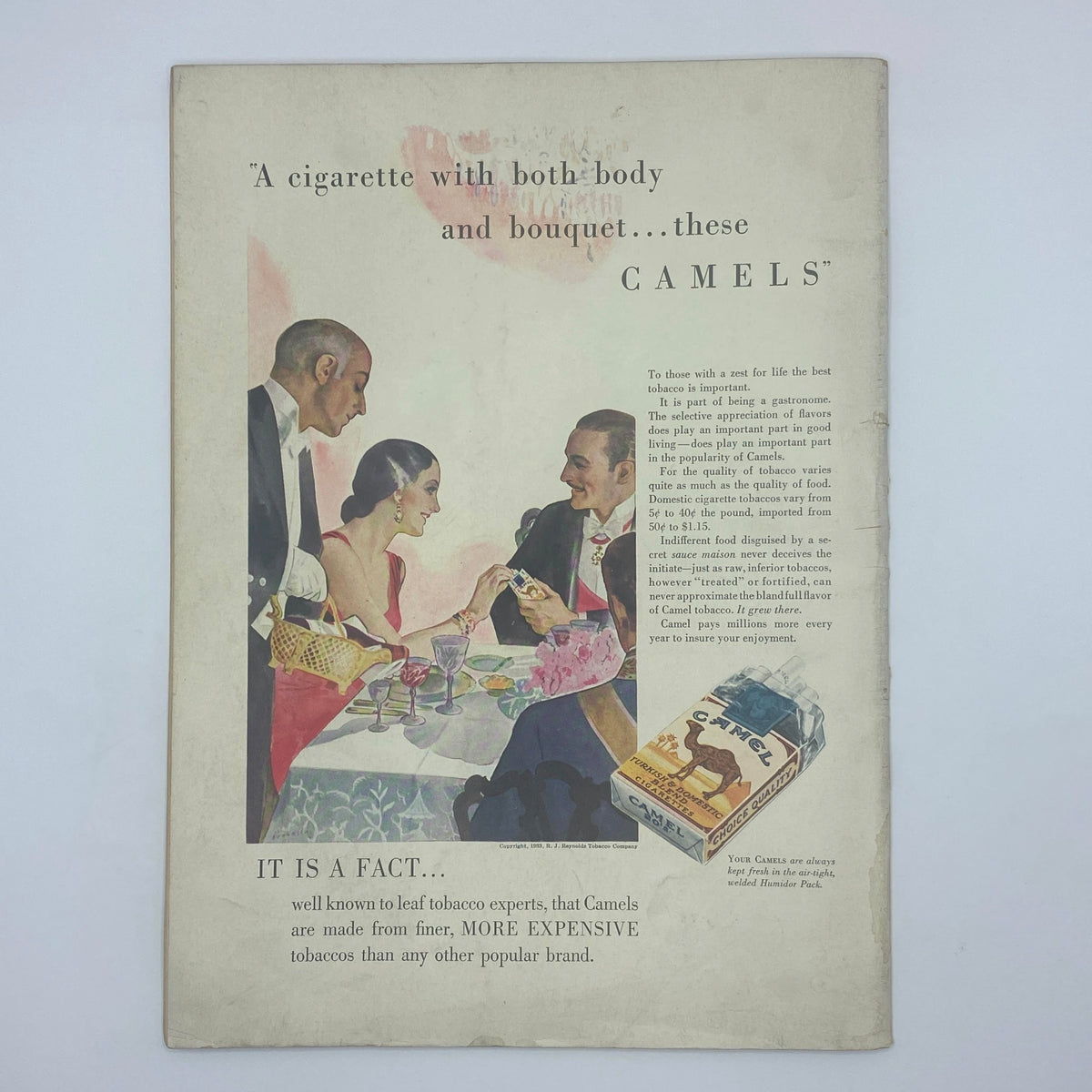 Vintage advertisement featuring a social gathering with a man and woman sharing Camel cigarettes, showcasing the text 'A cigarette with both body and bouquet...these CAMELS'. This historical piece is related to The New Yorker Complete Magazine March 25, 1933 Harry Brown Cover.