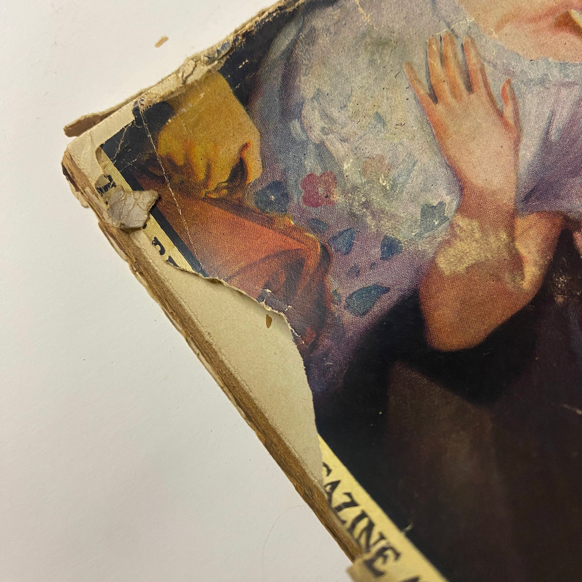 Detailed shot of the 1923 PEOPLE'S Pulp Magazine showing wear and tear on the cover. Illustrates the vintage appeal and authenticity of this collectible pulp fiction magazine.