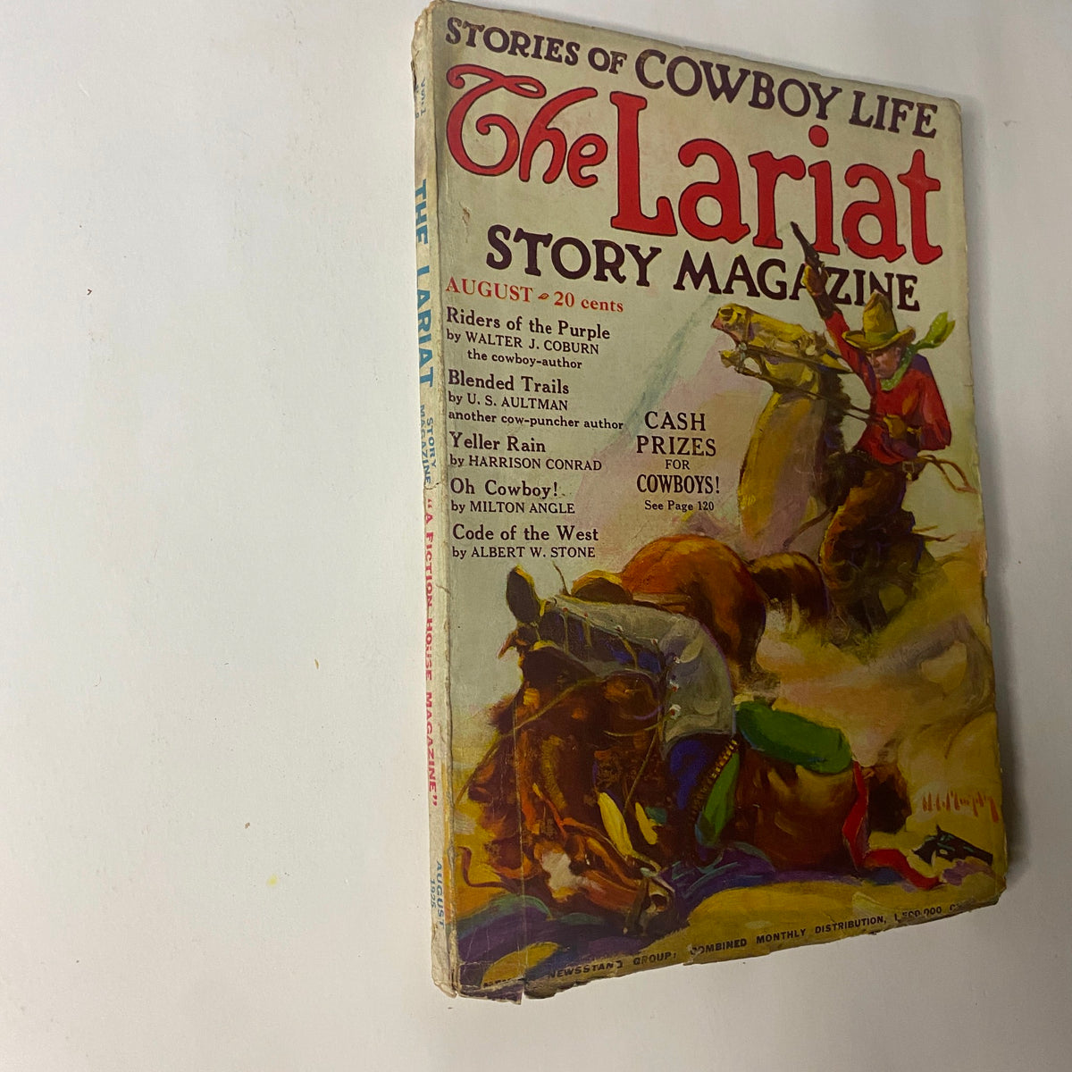 angled view of The Lariat Story Magazine August 1925, emphasizing its colorful cover art related to cowboy culture and adventure.