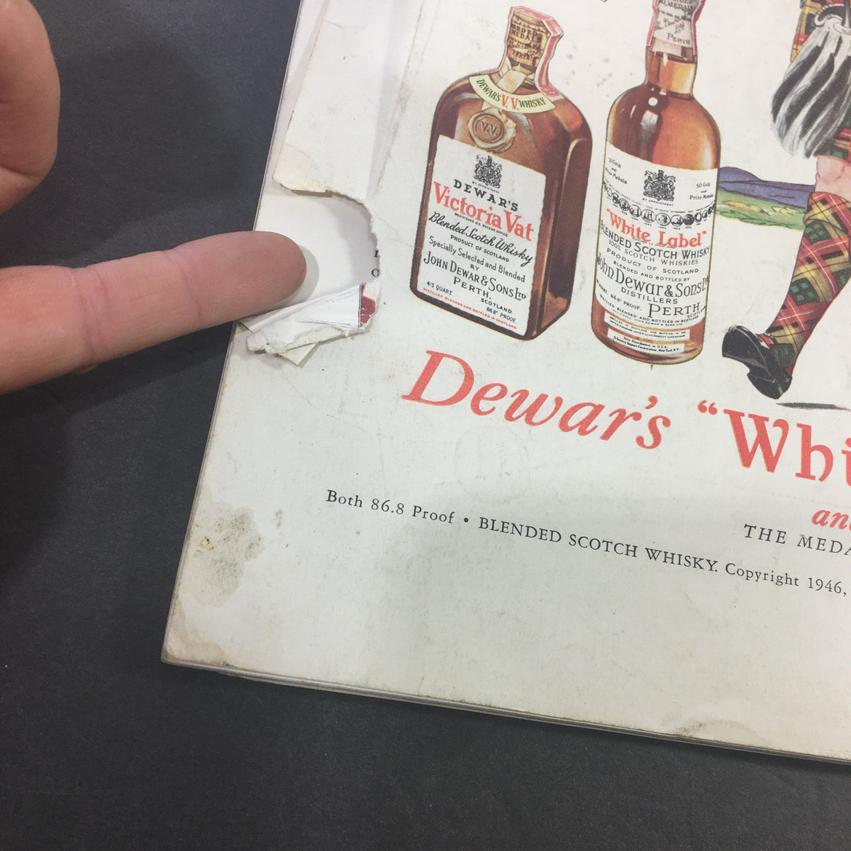 Close-up of vintage advertisement in VTG Gourmet Magazine August 1946 showing detail of Dewar's White Label and Victoria Vat Scotch Whisky.