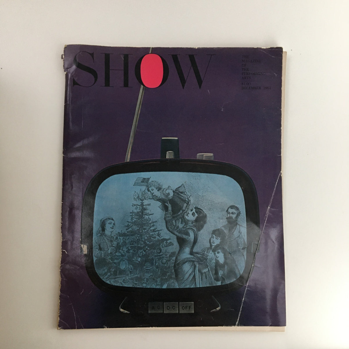 Cover of Show Magazine December 1961 Vol. 1 No. 3 featuring a vintage illustration of a woman with a Christmas tree inside an old television set, representing the Mask of Comedy & Tragedy theme.