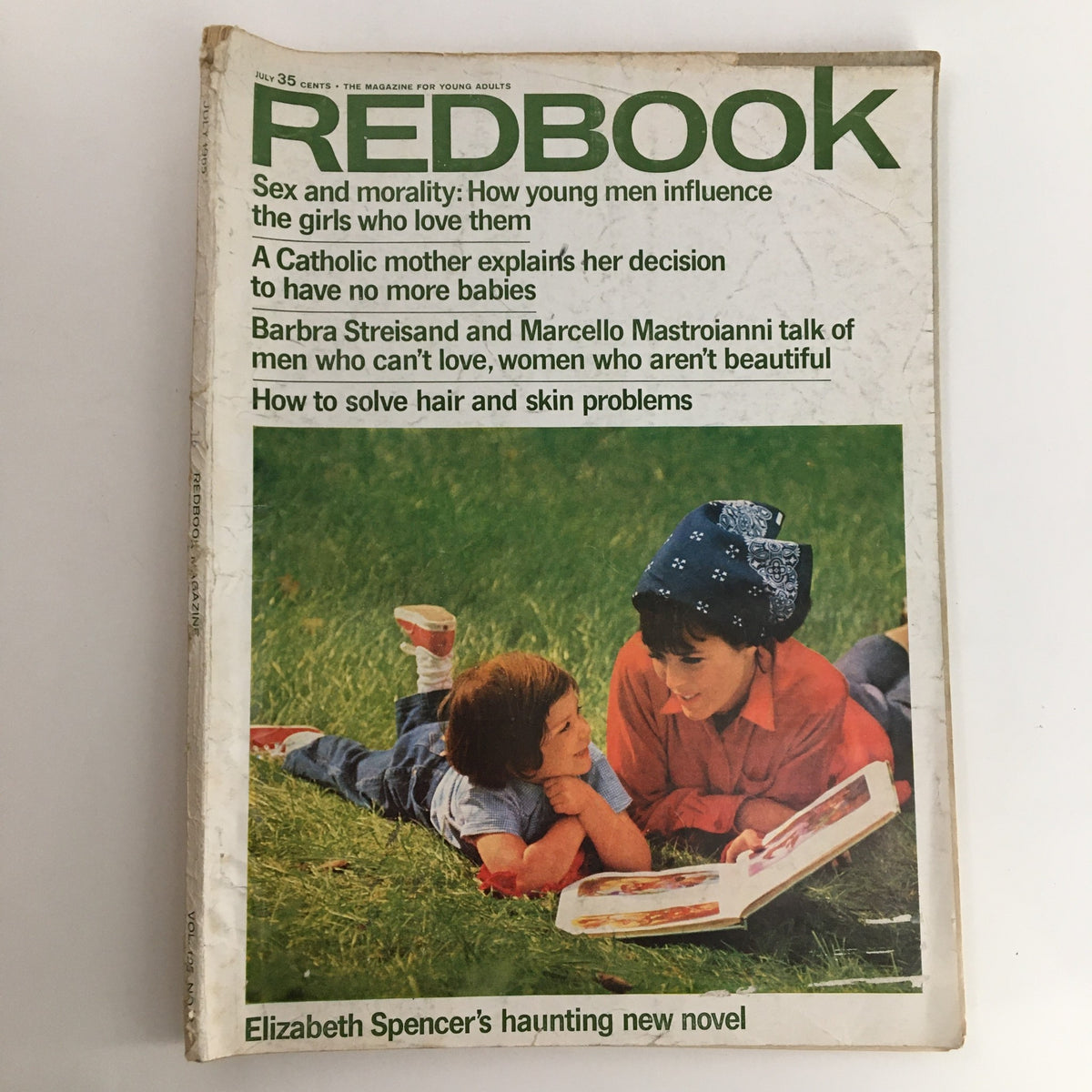 Cover of Redbook Magazine, July 1965, featuring Elizabeth Spencer's haunting new novel, with an image of two children reading together and articles on young adults, sex, and morality.