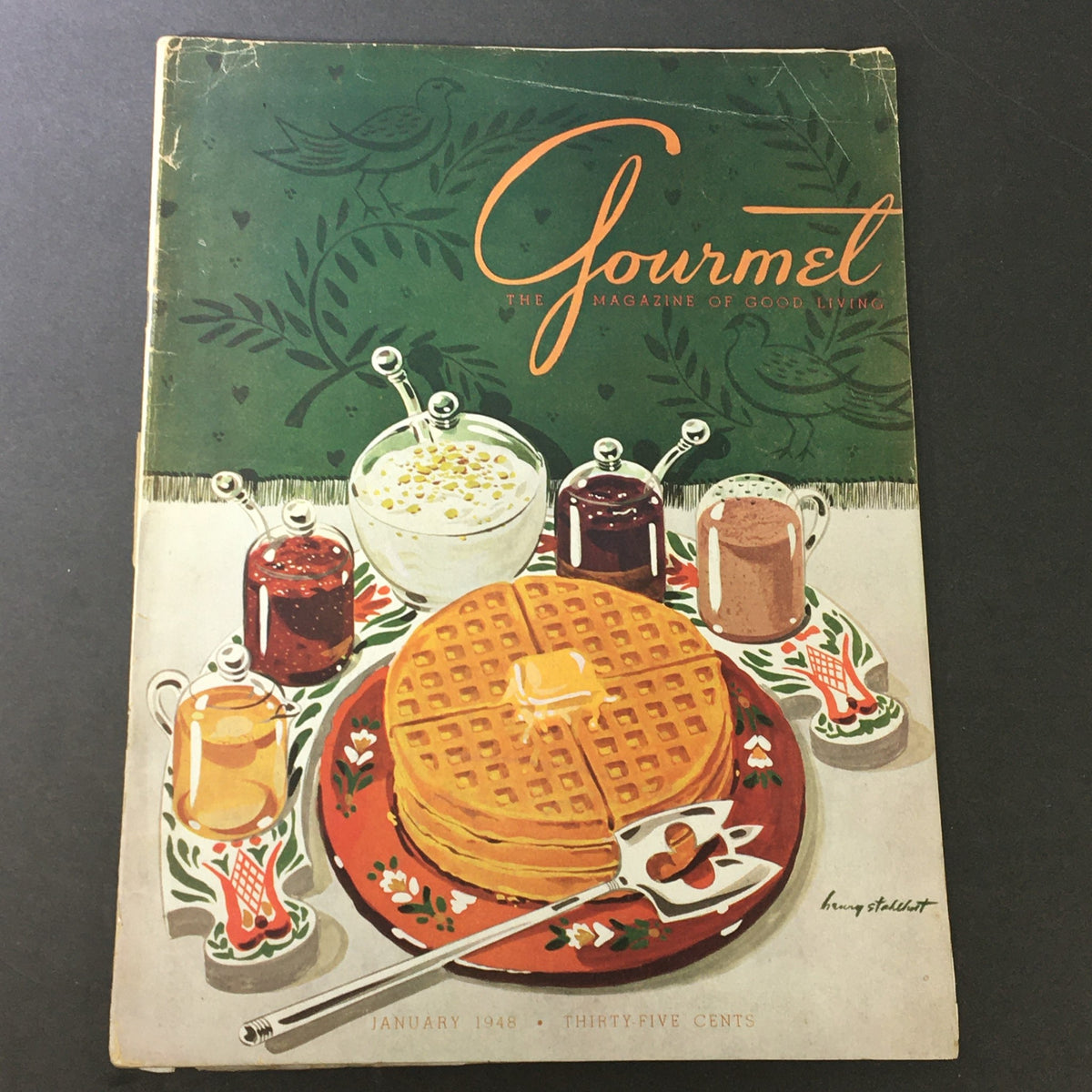 Vintage January 1948 edition of VTG Gourmet: The Magazine of Good Living showcasing a delicious breakfast spread with waffles and various toppings.