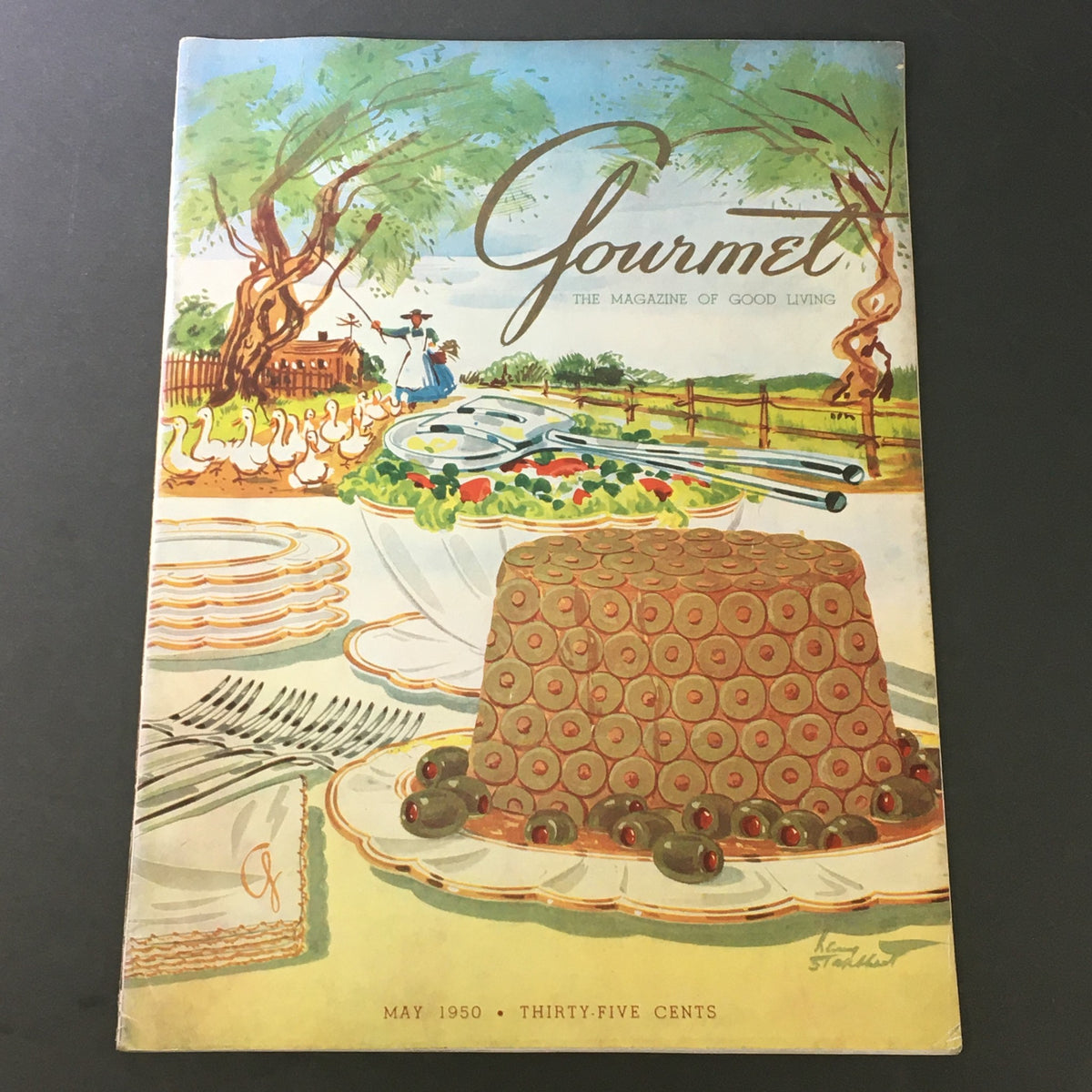 Cover of VTG Gourmet The Magazine of Good Living May 1950 featuring Uncle Edward's Lobster, showcasing a colorful illustration of a dining scene with food and nature.