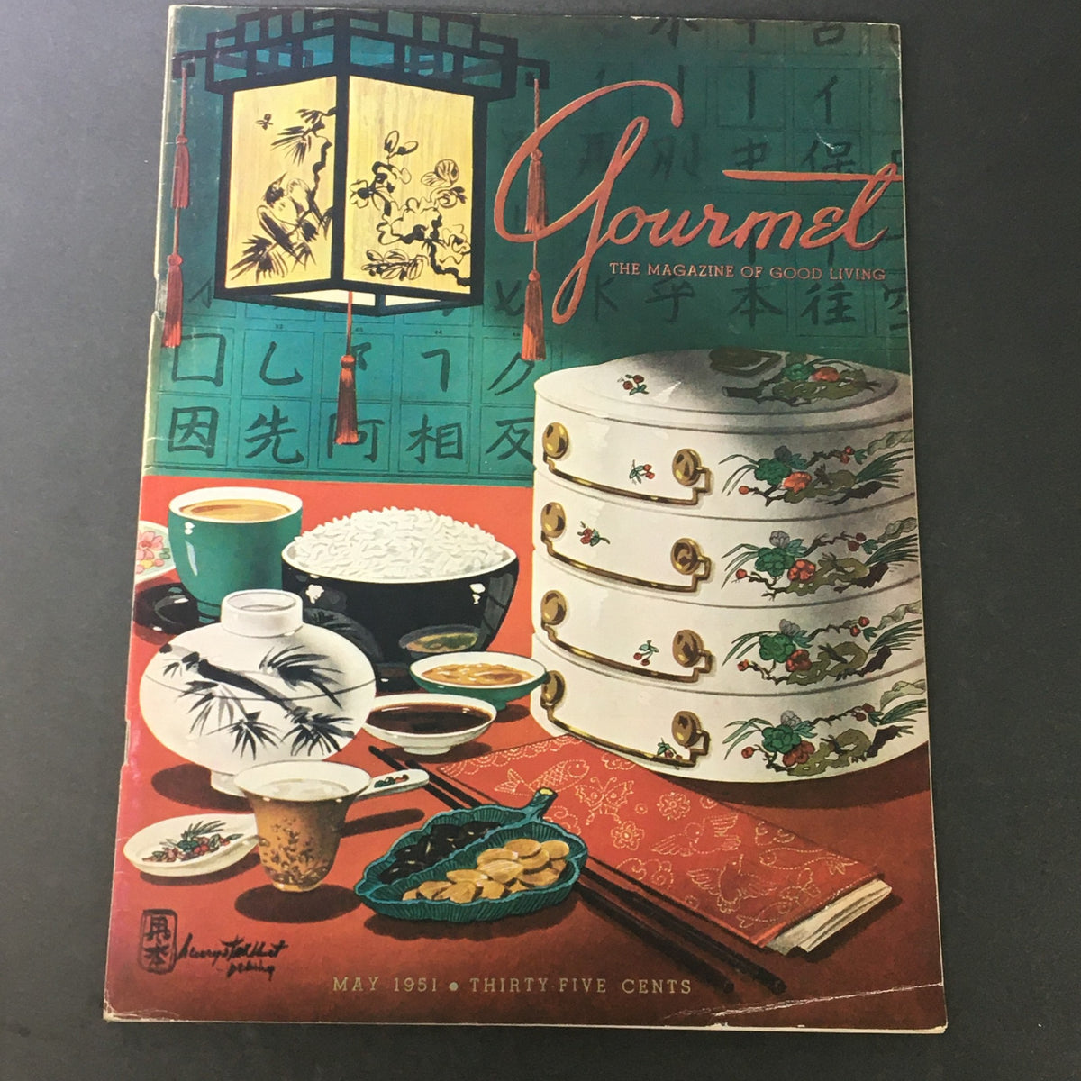 Cover of VTG Gourmet The Magazine of Good Living May 1951 featuring colorful illustrations of Asian cuisine, elegant dining setup, and vintage aesthetics.