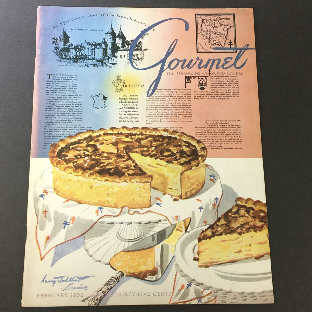 Cover of VTG Gourmet The Magazine of Good Living February 1952 featuring an artistic illustration of a pie on a dining table and the title prominently displayed. This issue includes the article 'Chef's Holiday, Part II' and highlights culinary delights from the 1950s.