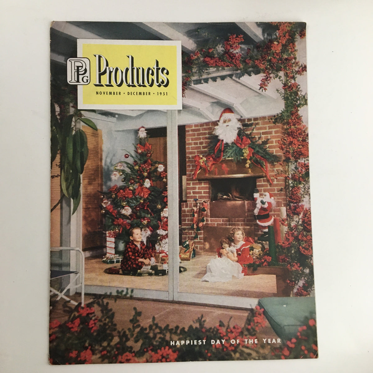 Cover of the 1951 November - December Products Happiest of the Year Price Catalog featuring a festive scene with children and Christmas decorations.