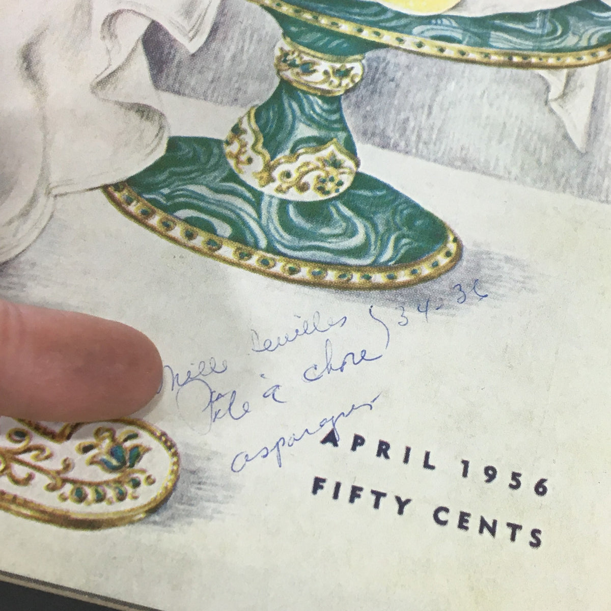 Close-up of VTG Gourmet Magazine - April 1956, displaying handwritten notes and details from the cover featuring exquisite food and dining themes.
