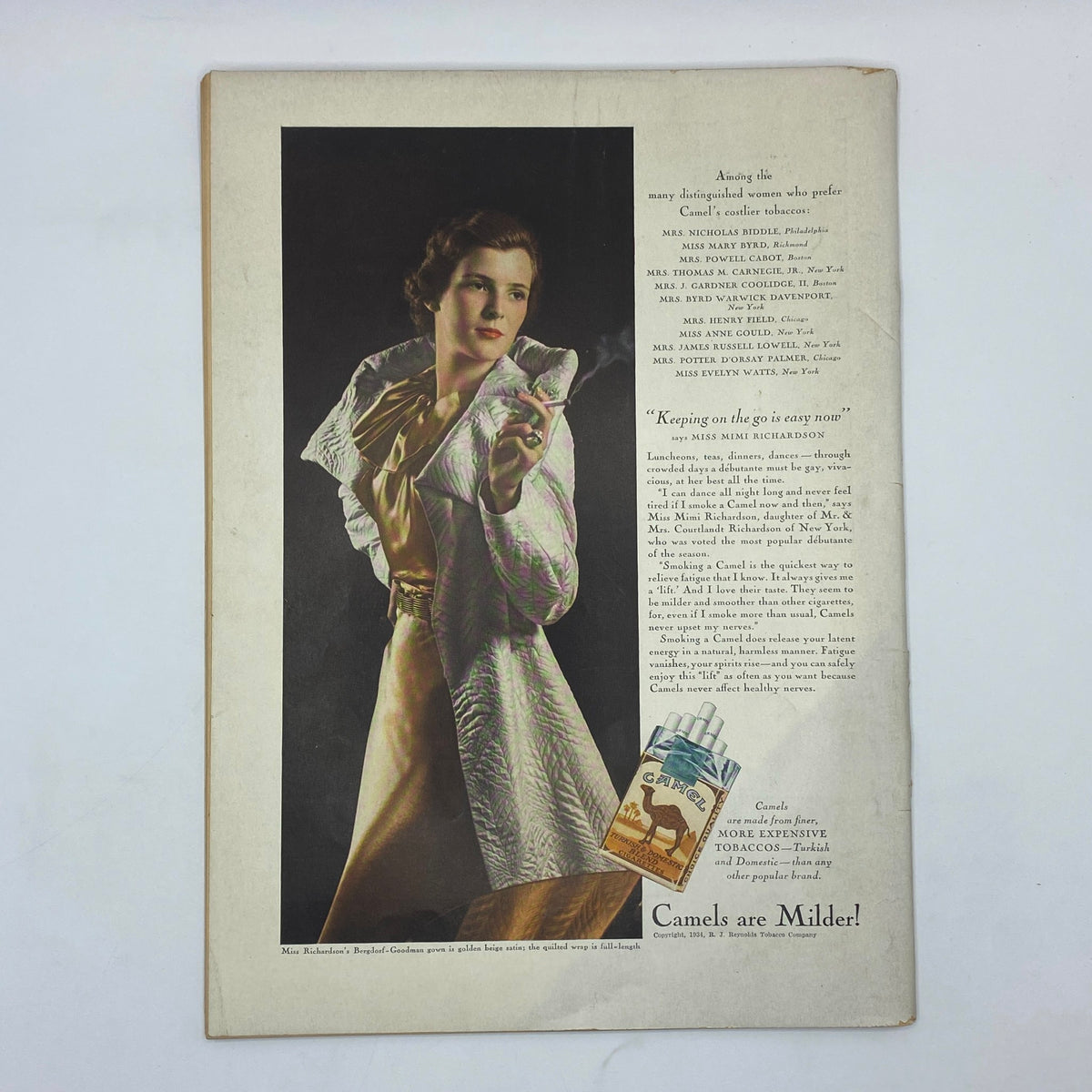 Advertisement page from The New Yorker magazine dated November 3, 1934, featuring a woman in elegant attire promoting Camel cigarettes, illustrating the period's fashion and lifestyle.