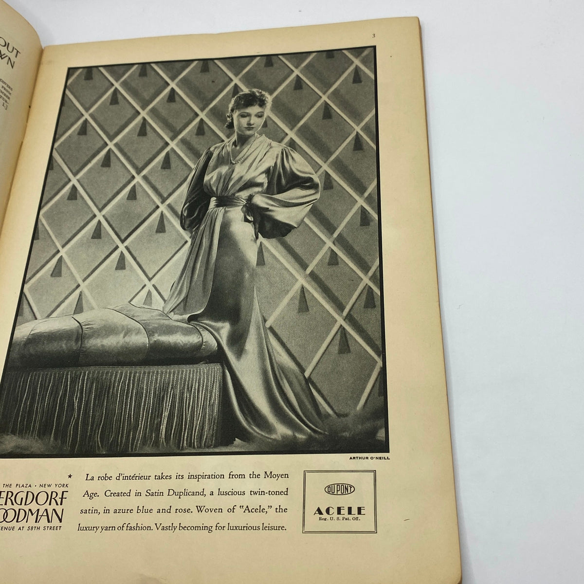 Vintage advertisement from The New Yorker magazine featuring a model in luxurious satin attire inspired by the Moyen Age, highlighting fashion trends of the 1930s. The New Yorker Complete Magazine November 24, 1934 William Cotton Cover.