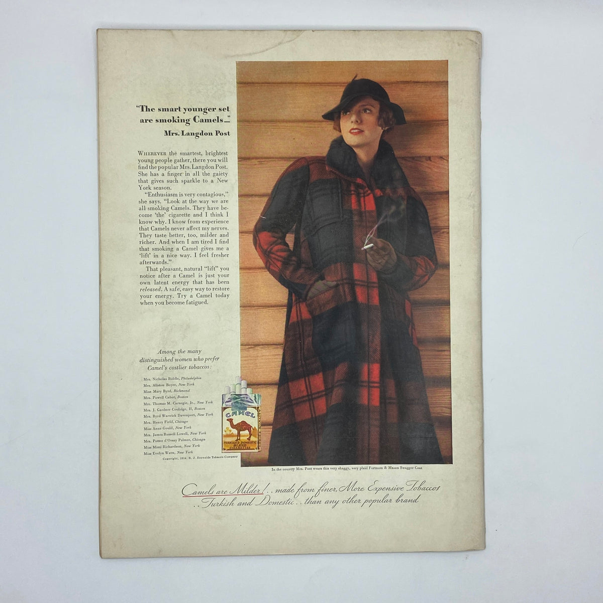 Advertisement for Camel cigarettes in The New Yorker Complete Magazine December 29, 1934, featuring a woman in a plaid coat, illustrating early 20th-century lifestyle and fashion.