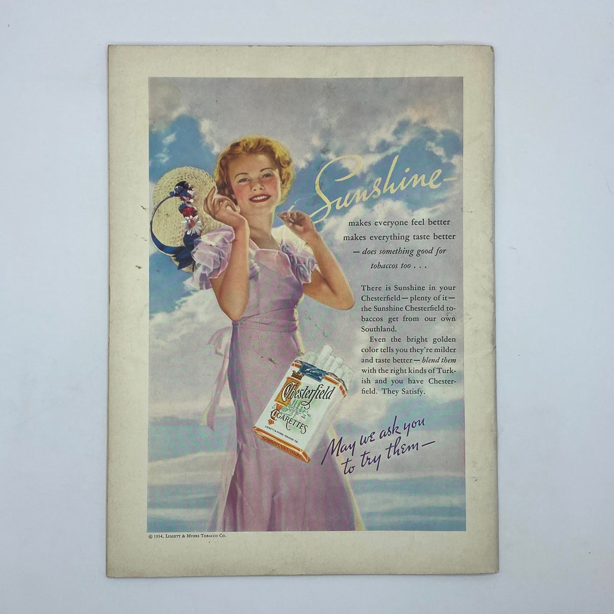 Advertisement page from The New Yorker Complete Magazine August 4, 1934 featuring a woman in a pink dress promoting Chesterfield cigarettes under the title 'Sunshine'.