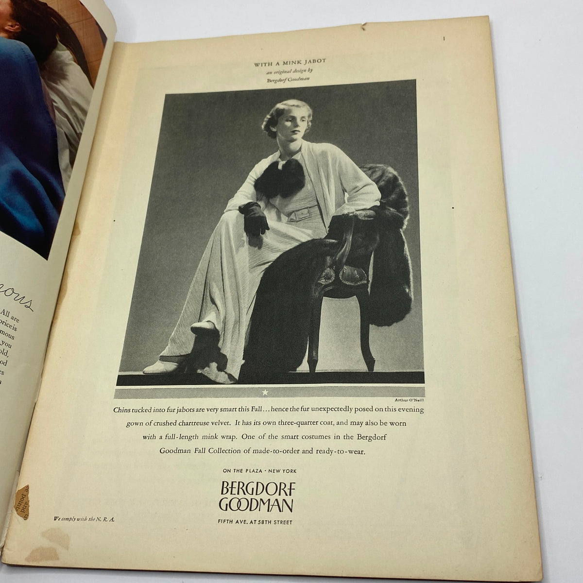 Fashion advertisement from The New Yorker Complete Magazine October 7, 1933, displaying a model in elegant attire with a mink jabot, illustrating the vintage fashion trends of the early 1930s.