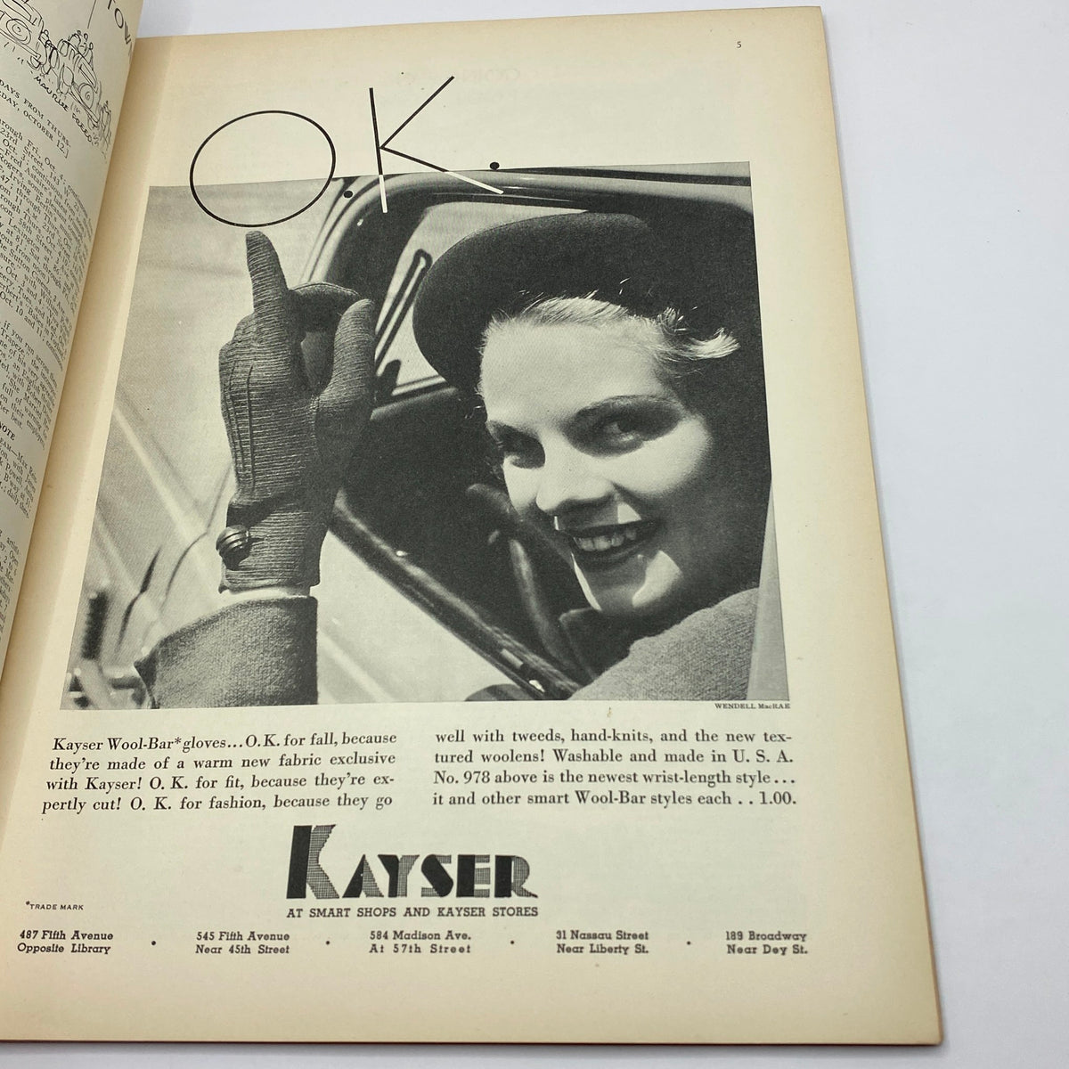Page from The New Yorker Complete Magazine October 5, 1935 featuring an advertisement for Kayser Wool-Bar gloves with a smiling woman in a car, showcasing vintage fashion and style.