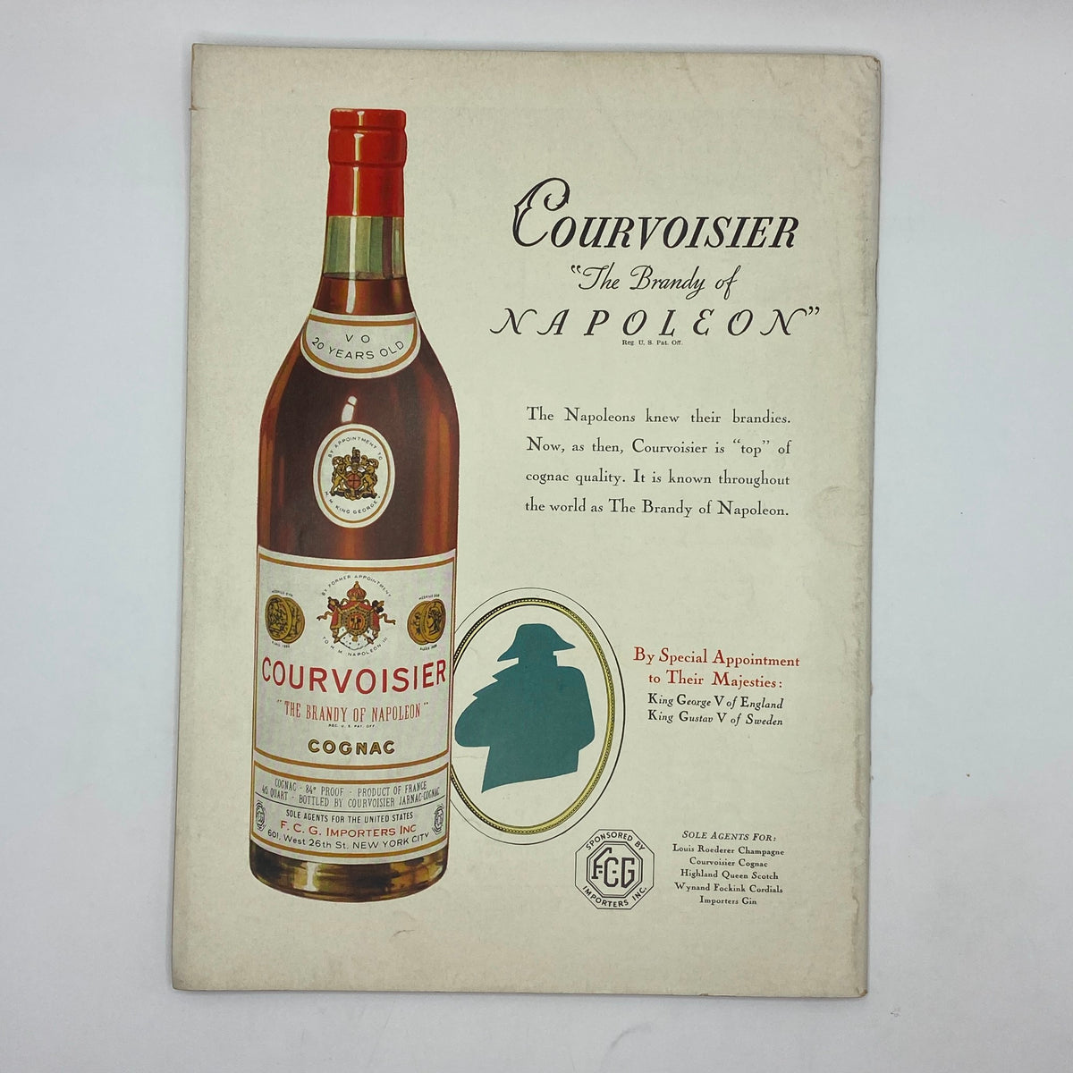 Advertisement for Courvoisier Cognac in The New Yorker Complete Magazine November 16, 1935, showcasing the iconic bottle with historical references and brand messaging.