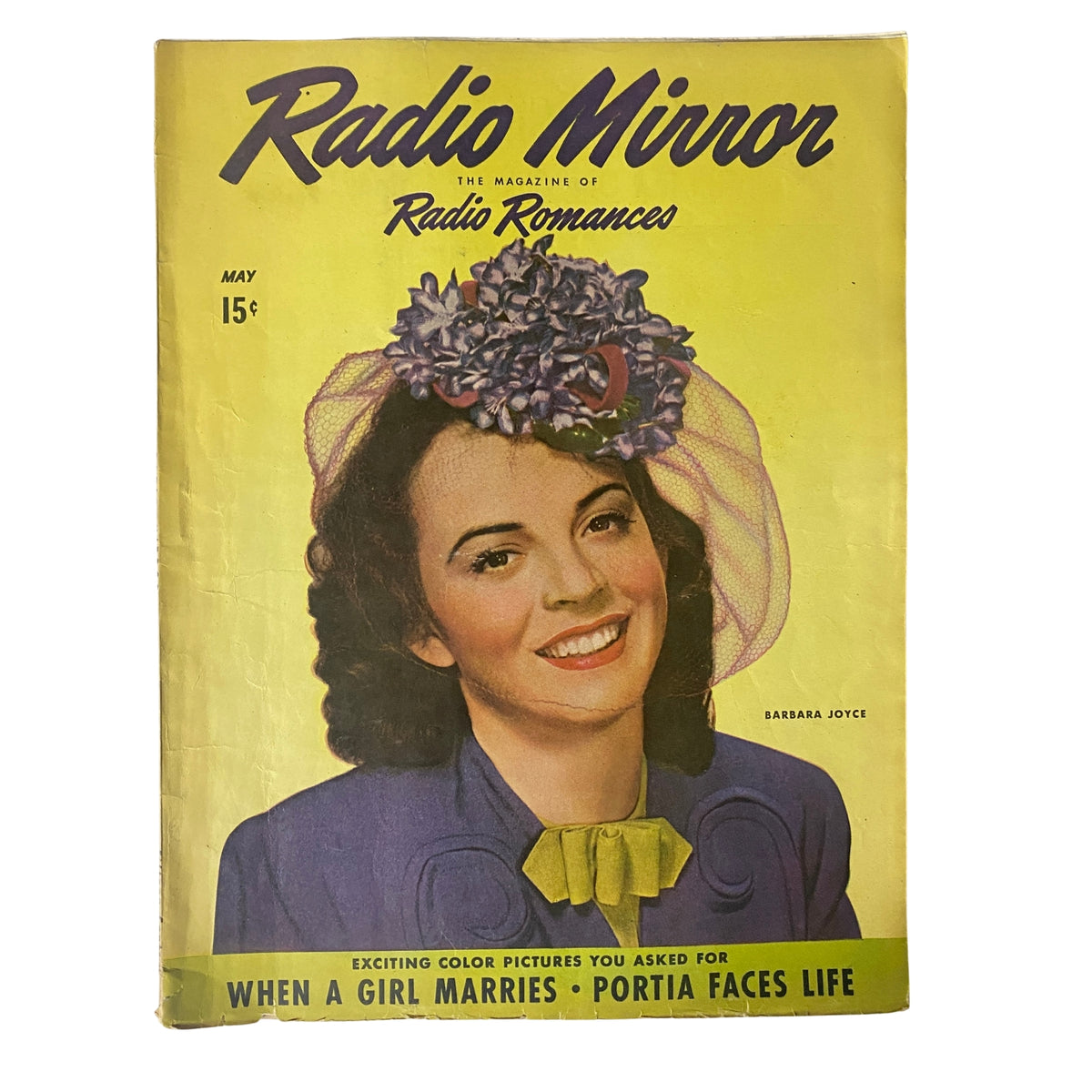 Cover of Radio Mirror Magazine May 1944 featuring Barbara Joyce, showcasing vibrant colors and a stylish hat, reflecting the fashion of the World War II era.