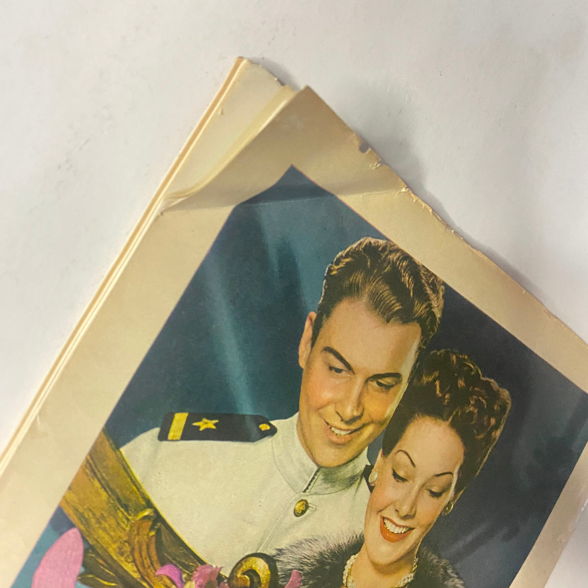 Close-up of Chesterfield Cigarettes advertisement in Radio Romances Magazine September 1945 showing a smiling couple with floral accents.