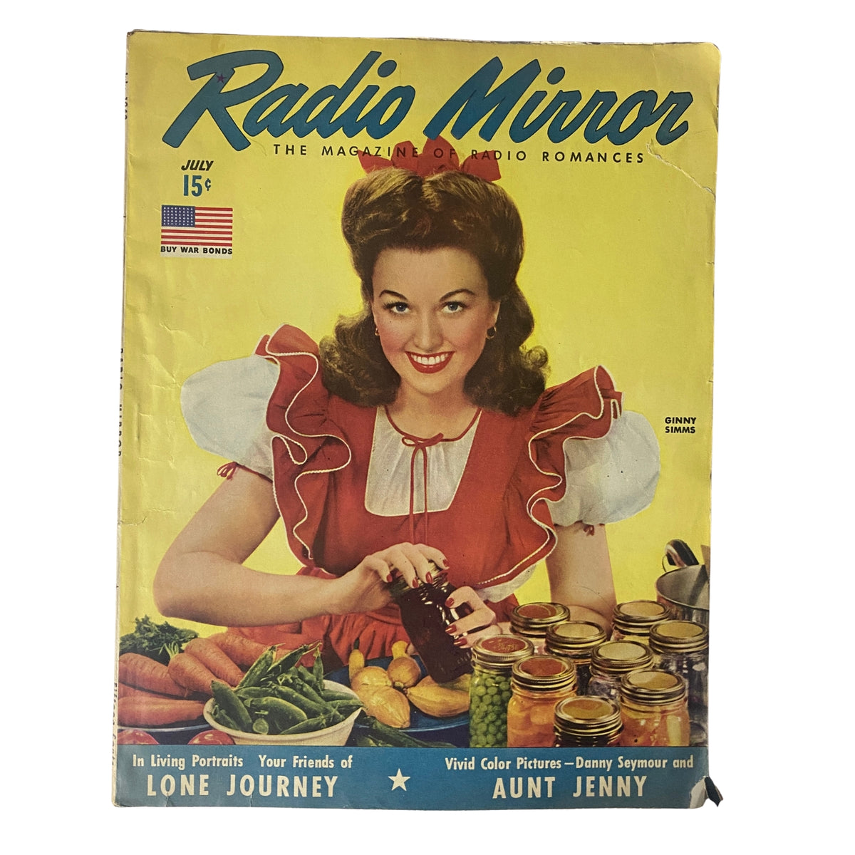 Radio Romances Magazine July 1943 featuring Ginny Simms on the cover, showcasing a vintage color portrait designed by Tom Kelley, emphasizing the nostalgia of classic radio entertainment.