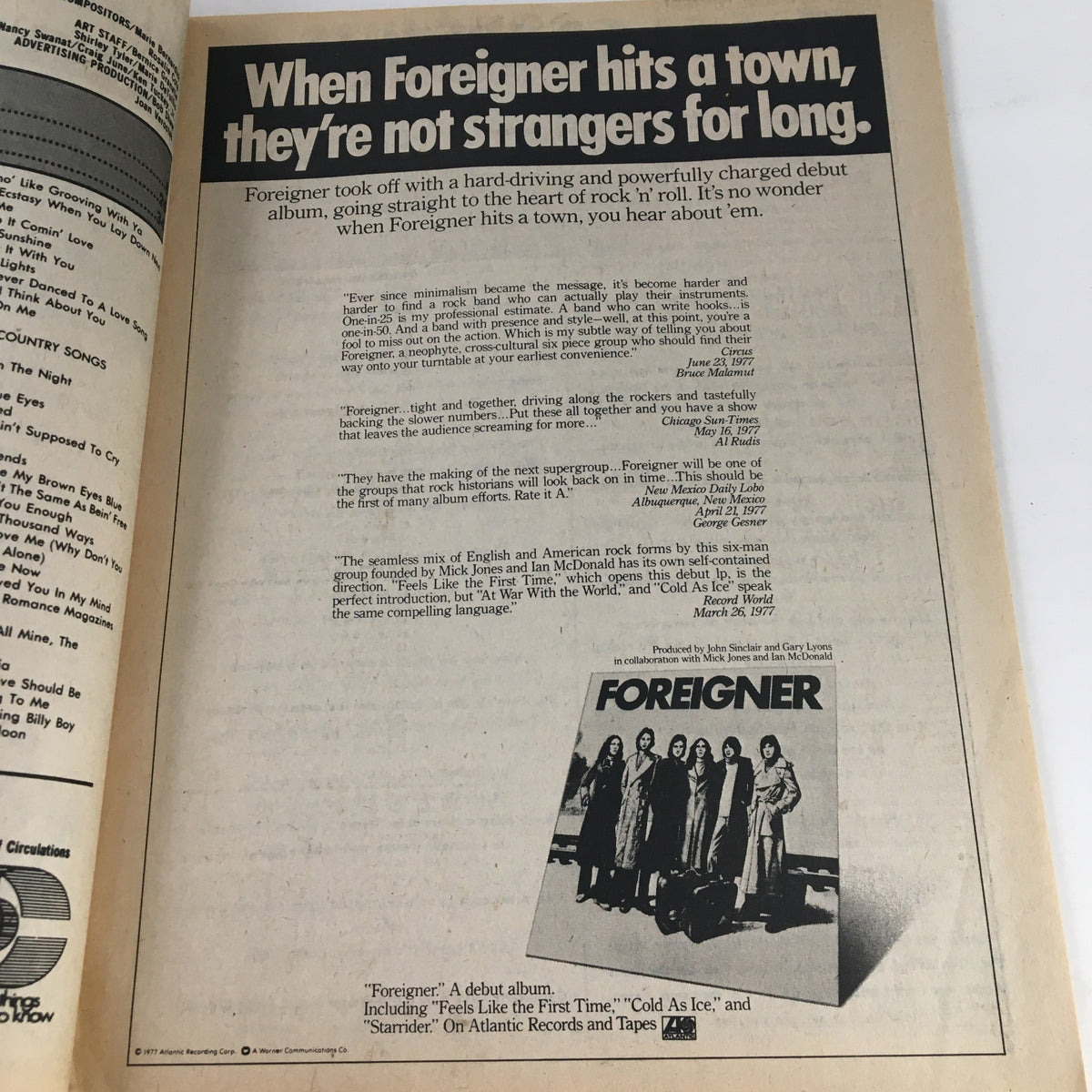 Song Hits Magazine December 1977 featuring an advertisement for the band Foreigner's debut album, showcasing the band members and promotional quotes.
