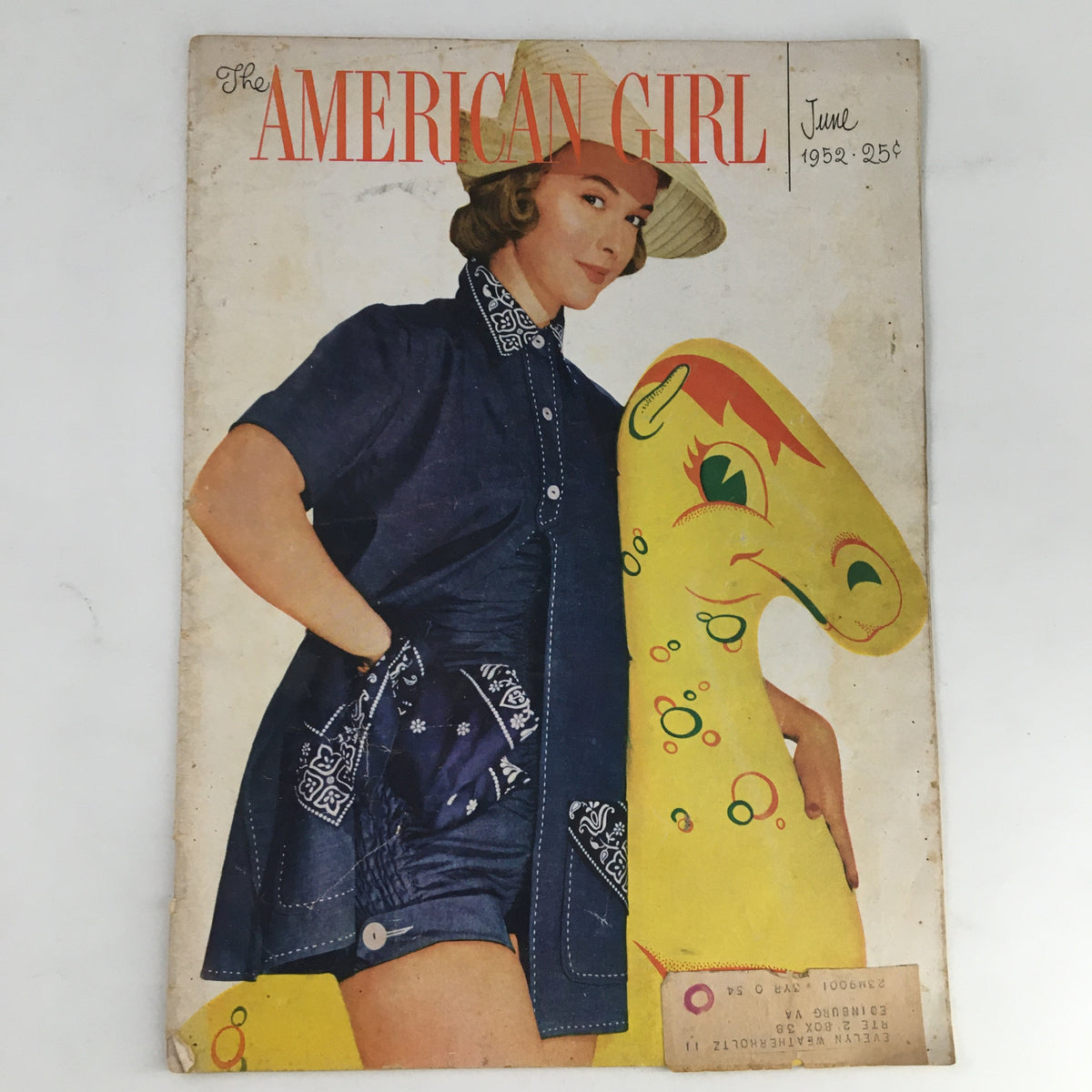 The American Girl Magazine June 1952 cover featuring Helen Ryan with Sandy the Sea Horse. This vintage magazine showcases 1950s American culture, including vibrant illustrations and nostalgic themes.